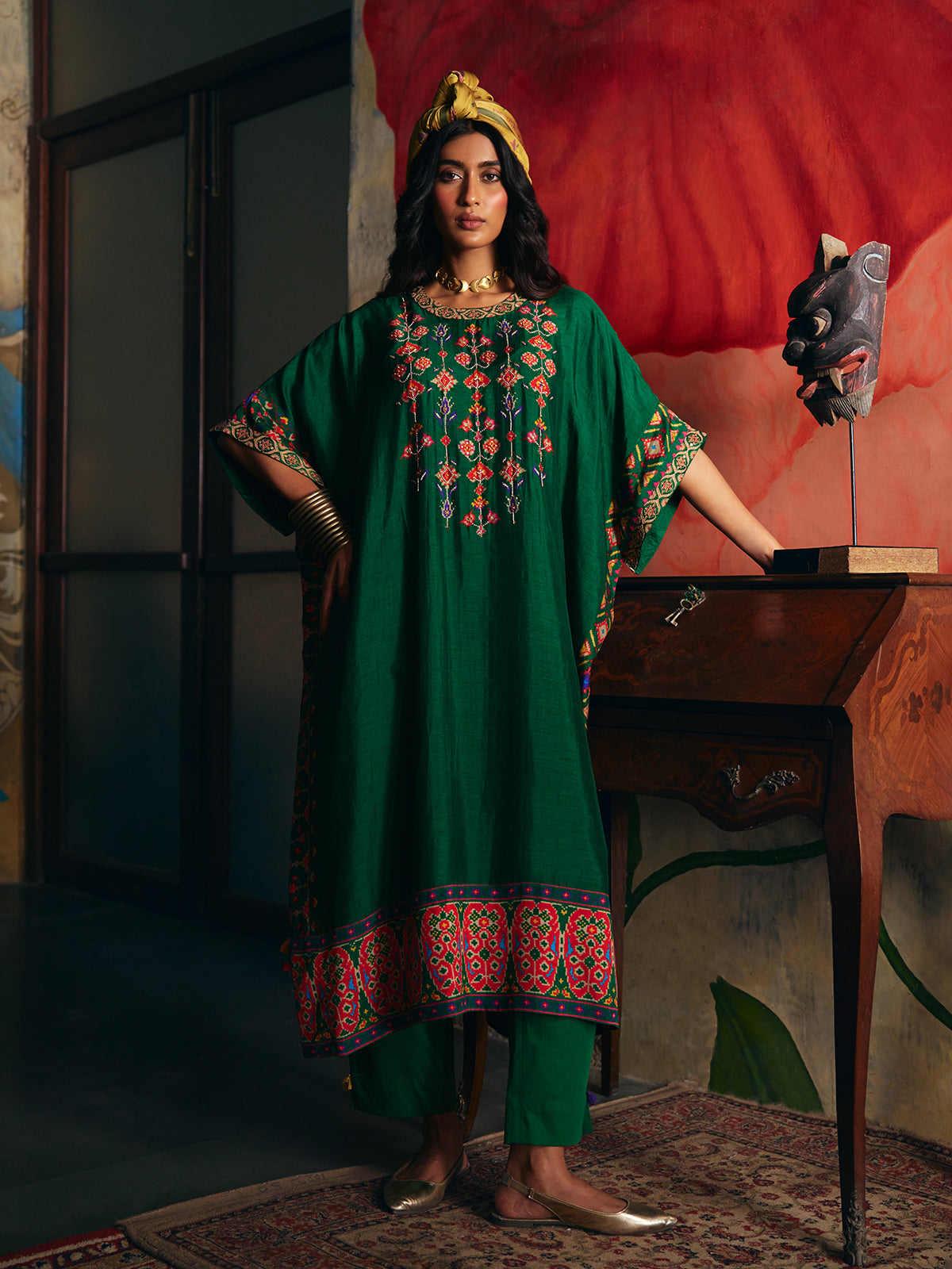 Mehendi green womens kaftan style suit with floral embroidery