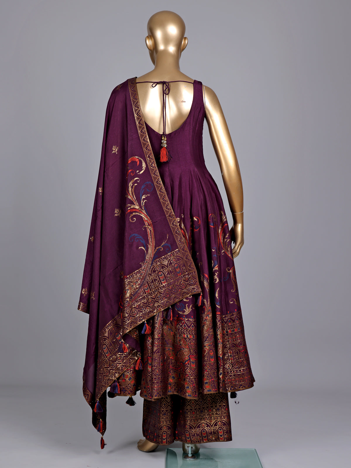Purple silk anarkali suit with zardosi and pearl embellished details
