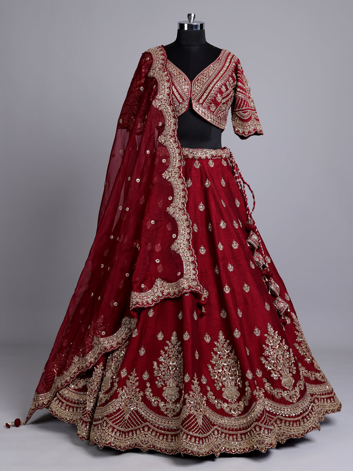 Maroon silk bridal lehenga choli with elegant zardosi embellishments
