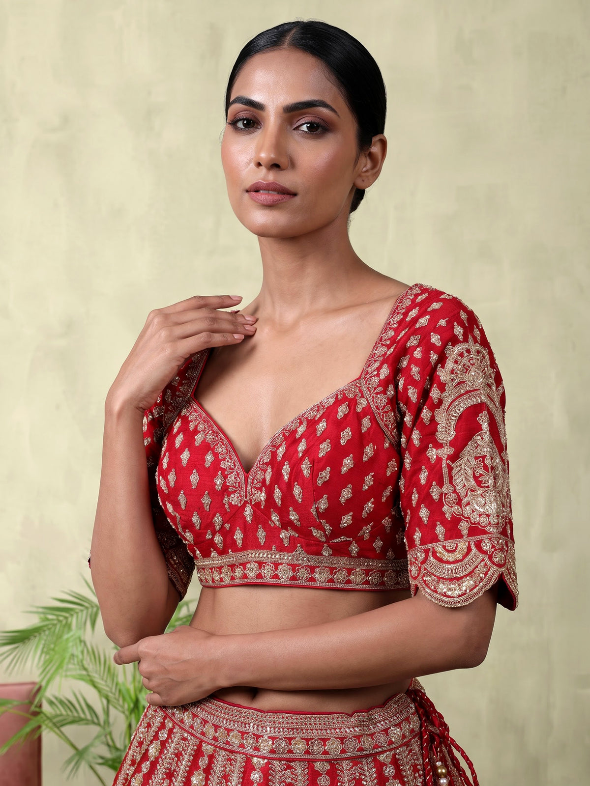 Red silk bridal lehenga choli with exquisite zardosi embellishments