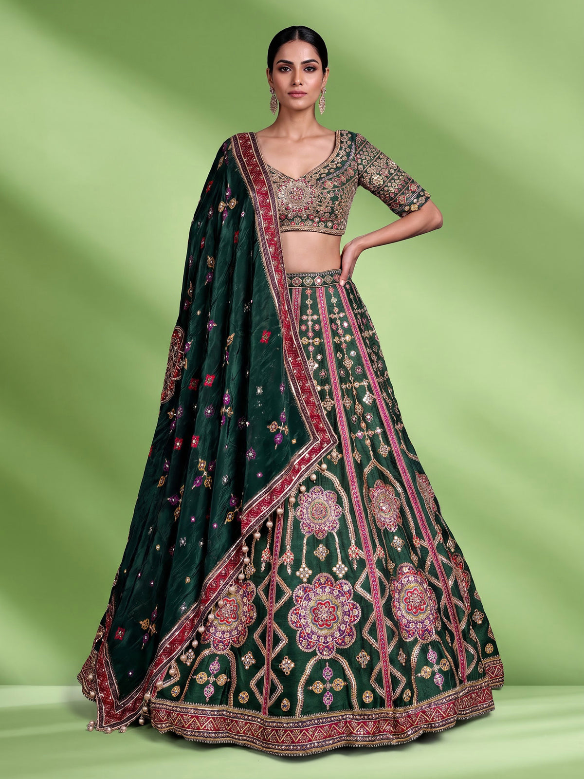 Green raw silk wedding wear lehenga choli with rich work