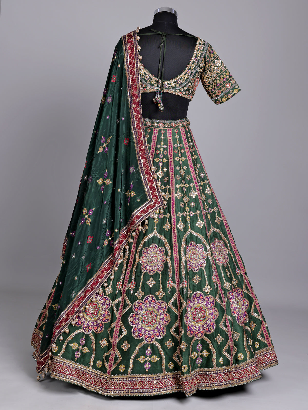 Green raw silk wedding wear lehenga choli with rich work