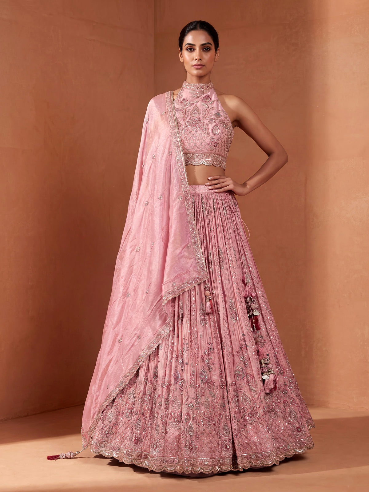 Pastel pink silk lehenga choli with embellished festive detailing