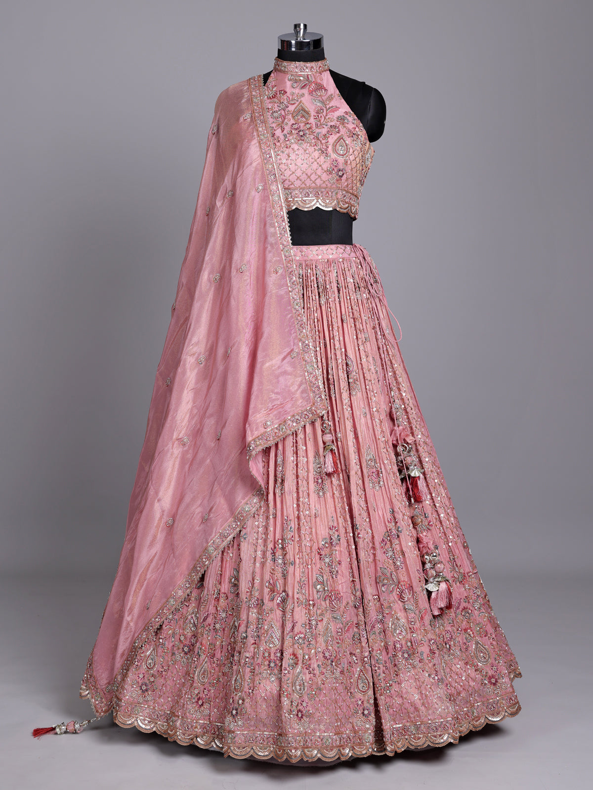 Pastel pink silk lehenga choli with embellished festive detailing
