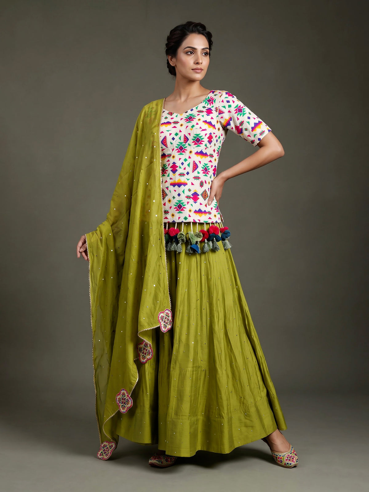 Green soft silk Navratri lehenga choli with delicate stone detailing