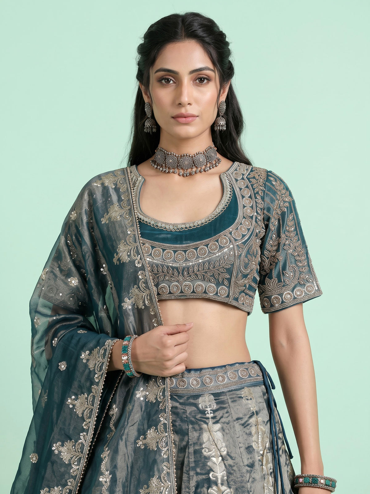 Teal blue banarasi silk lehenga choli with embellished dupatta
