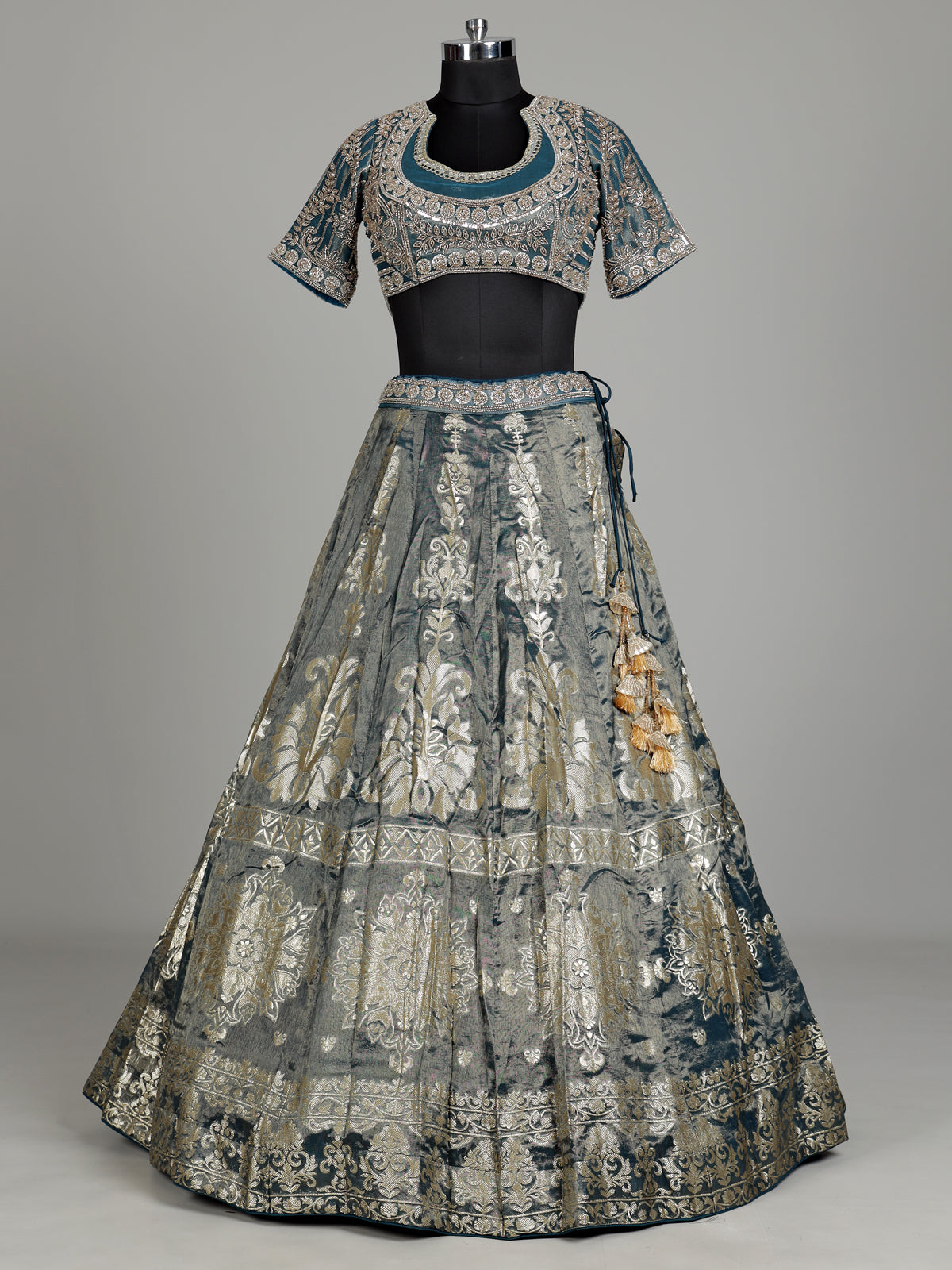 Teal blue banarasi silk lehenga choli with embellished dupatta