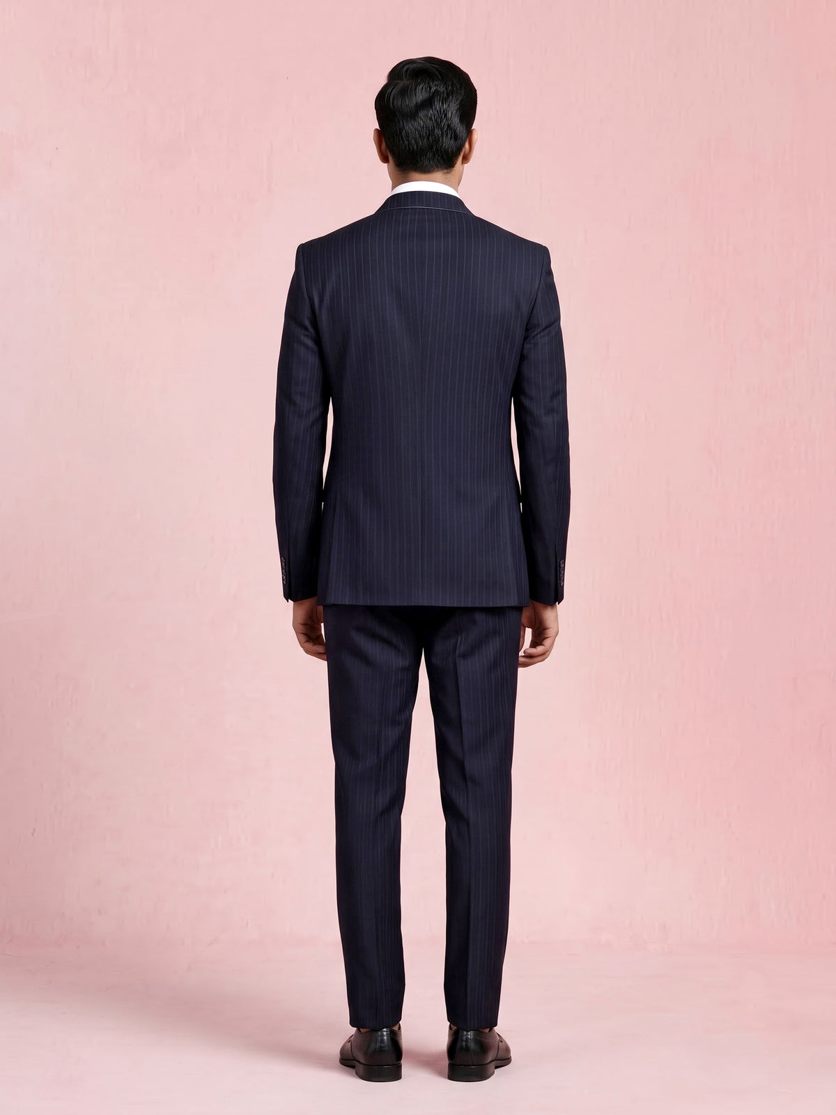 Midnight navy double-breasted tuxedo suit with metallic brooch