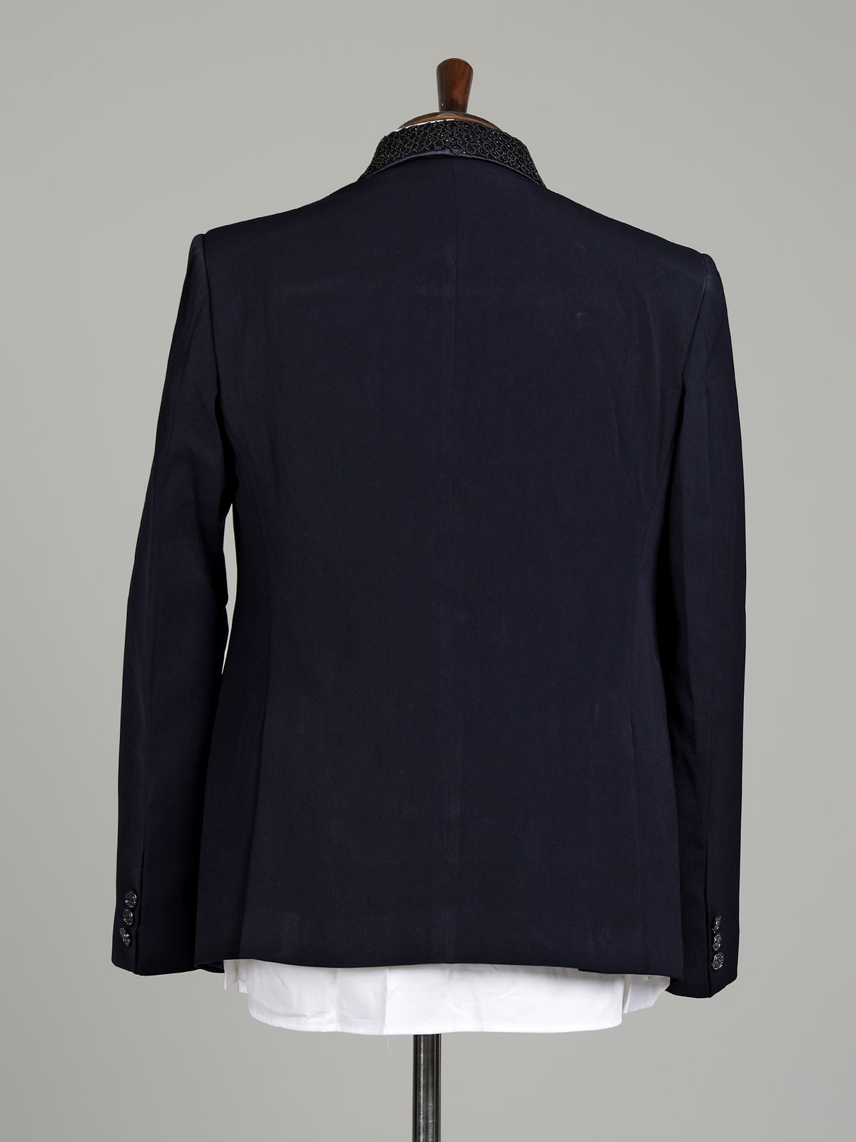 Midnight navy three-piece tuxedo suit with embellished shawl lapel