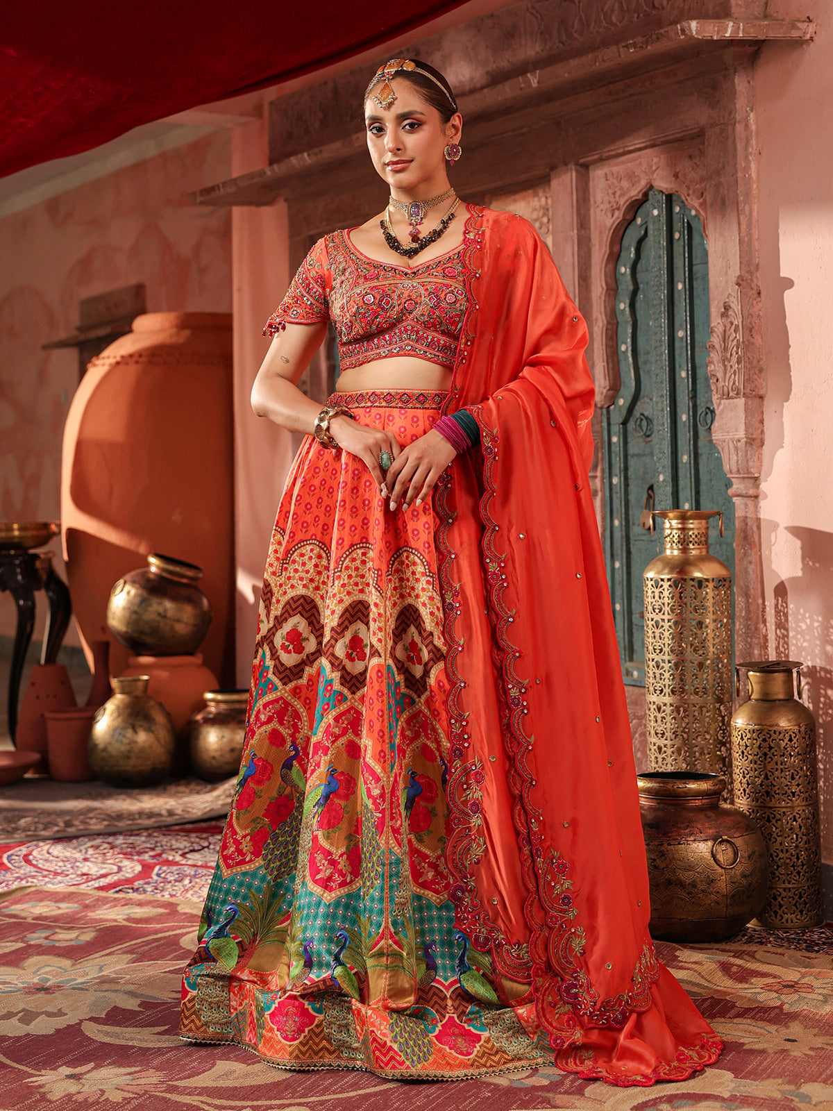Red traditional print lehenga choli with elegant embellished dupatta