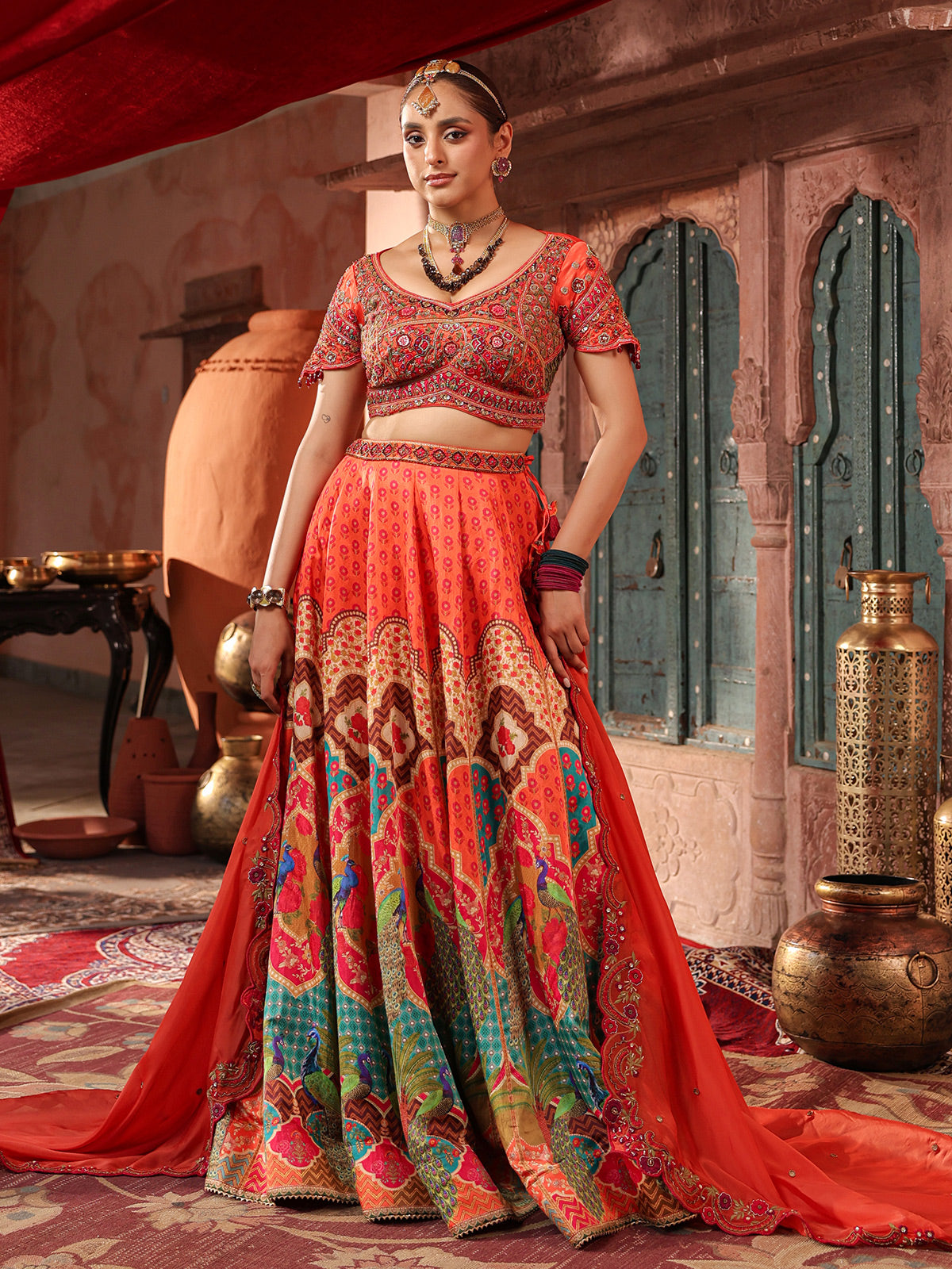 Red traditional print lehenga choli with elegant embellished dupatta
