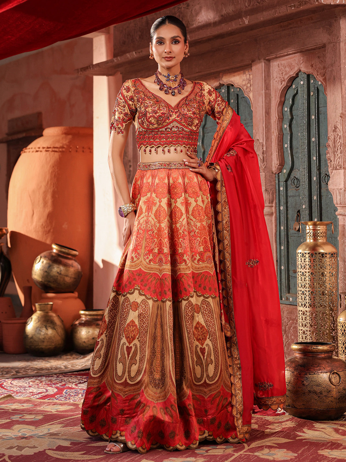 Red traditional printed lehenga choli with intricate zardosi details