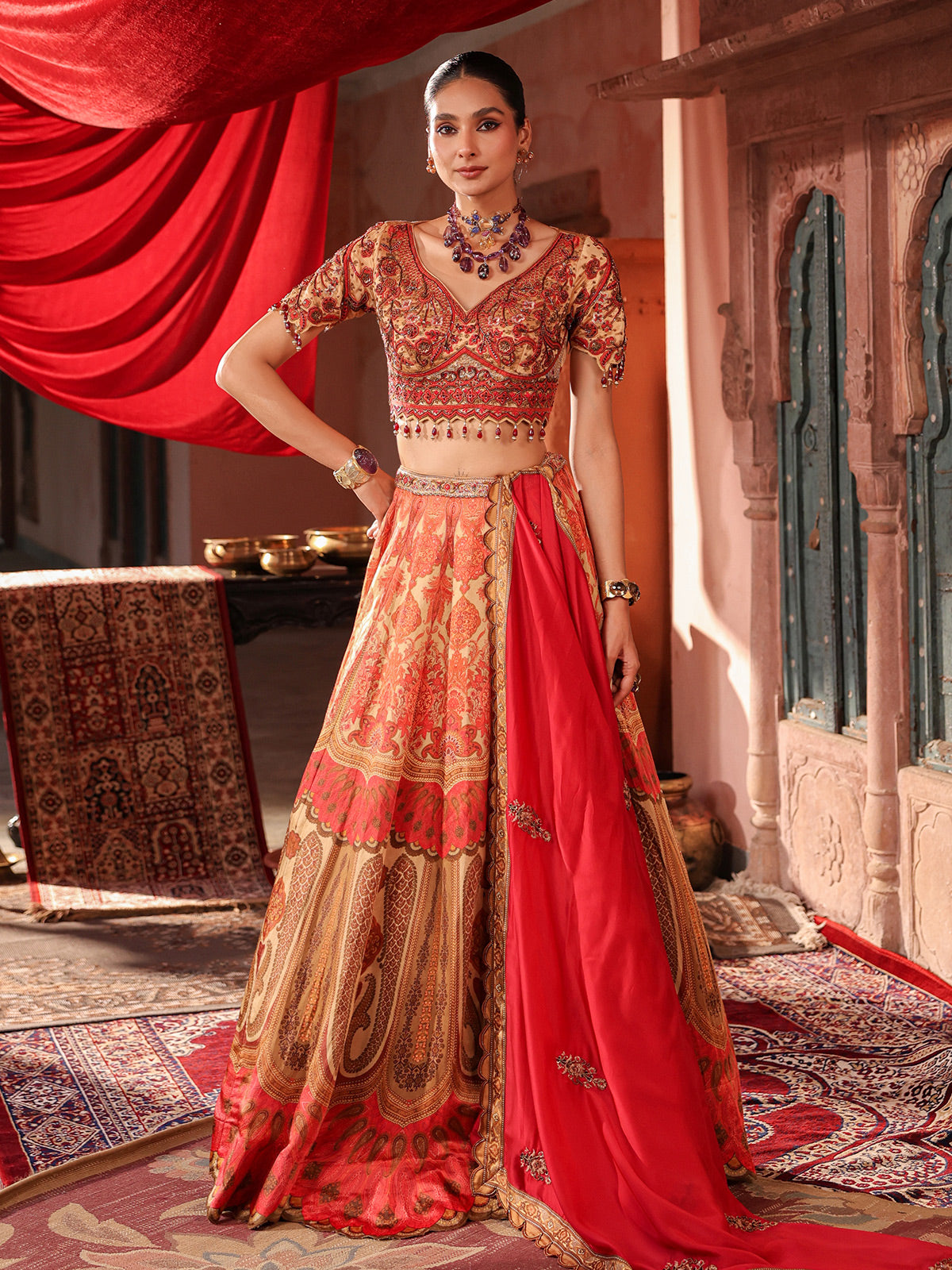 Red traditional printed lehenga choli with intricate zardosi details