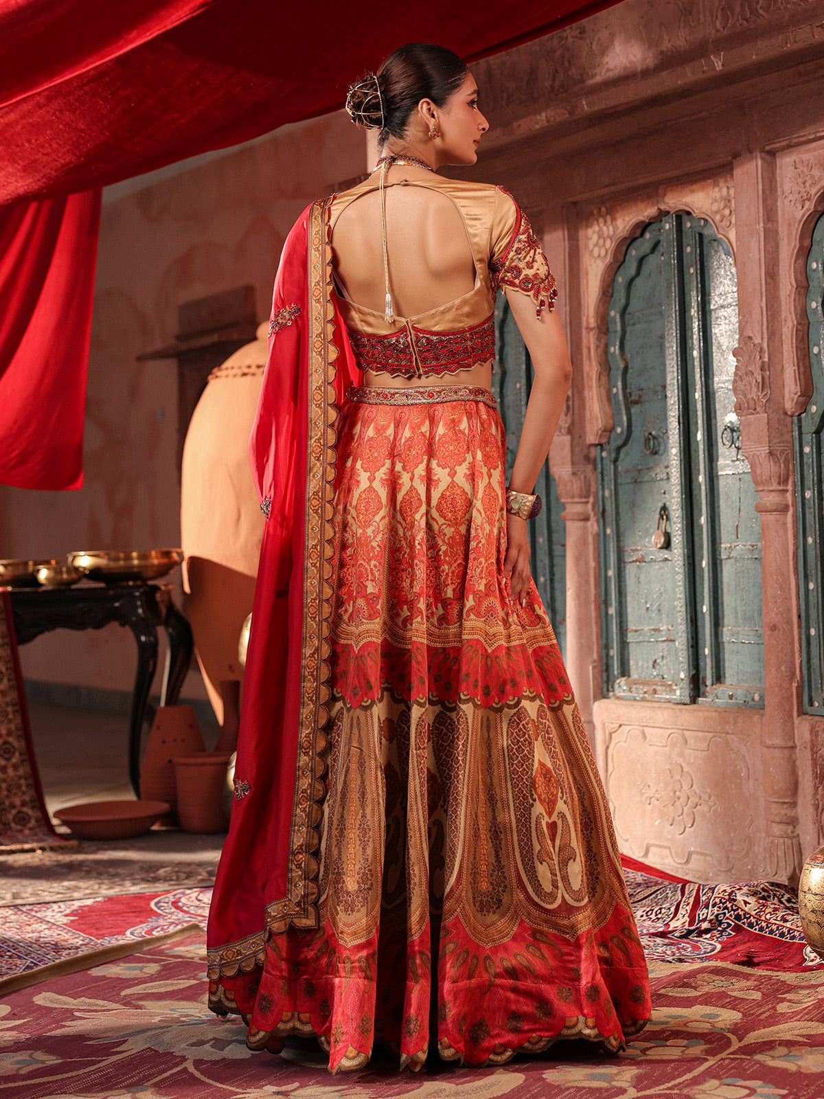 Red traditional printed lehenga choli with intricate zardosi details