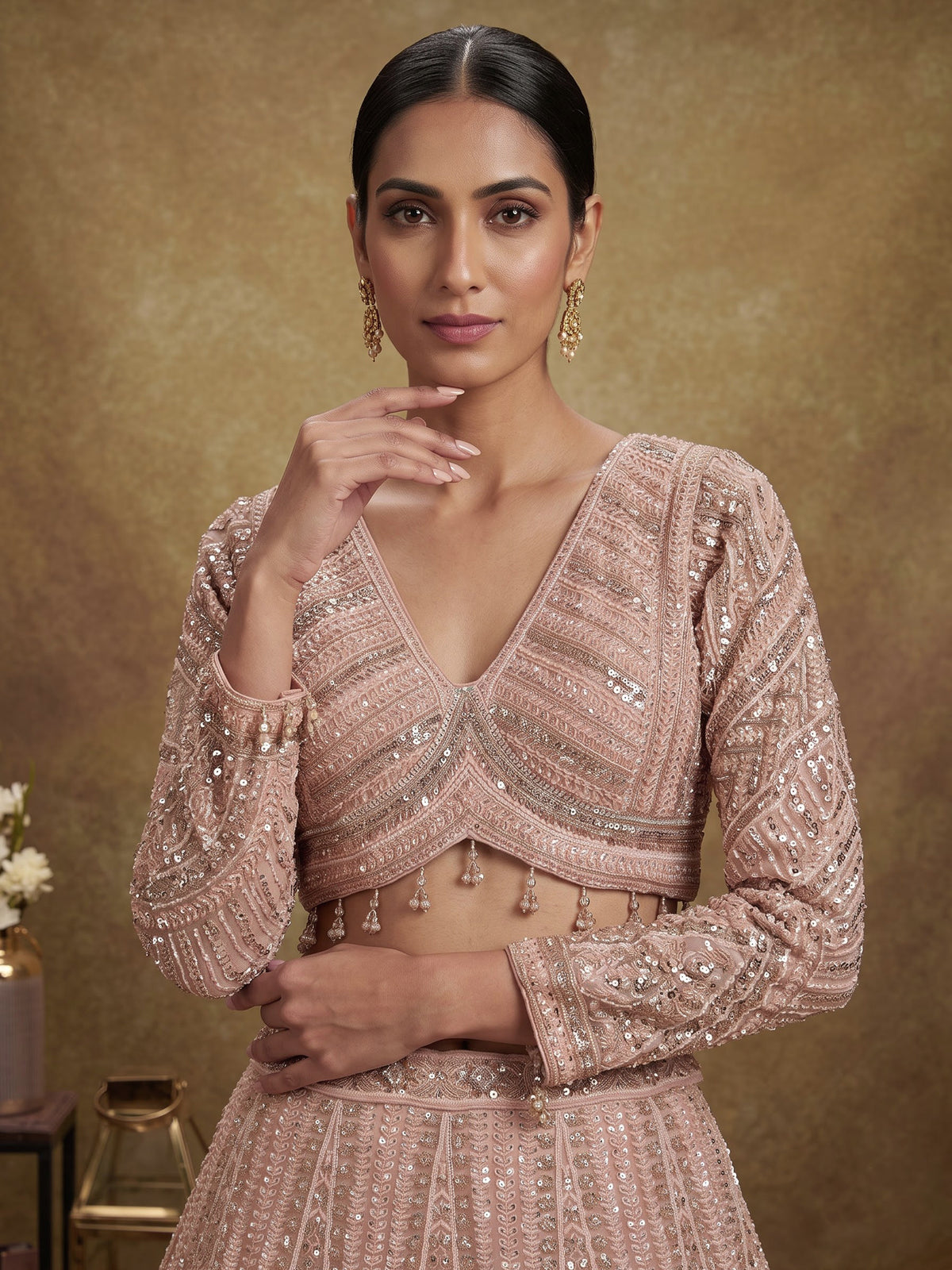 Peach net designer lehenga choli with intricate embellished dupatta
