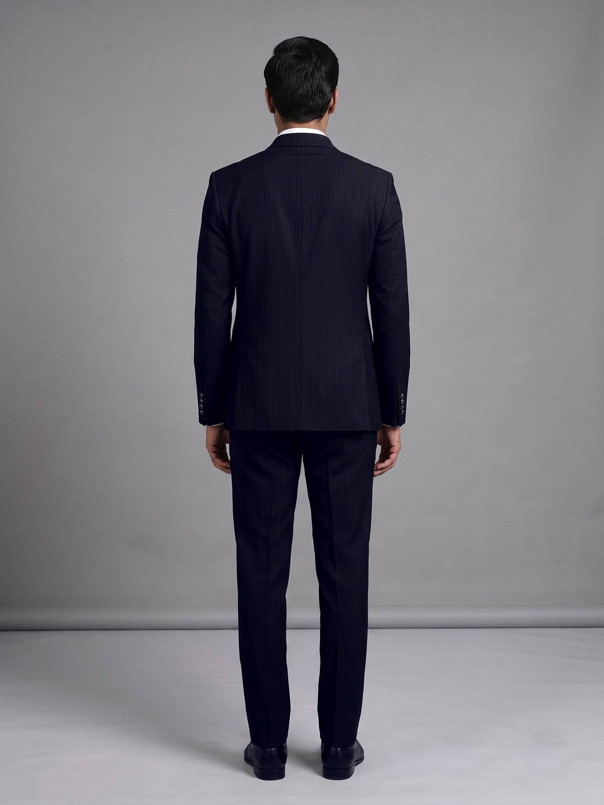 Black terry rayon double-breasted tuxedo suit with crystal brooch