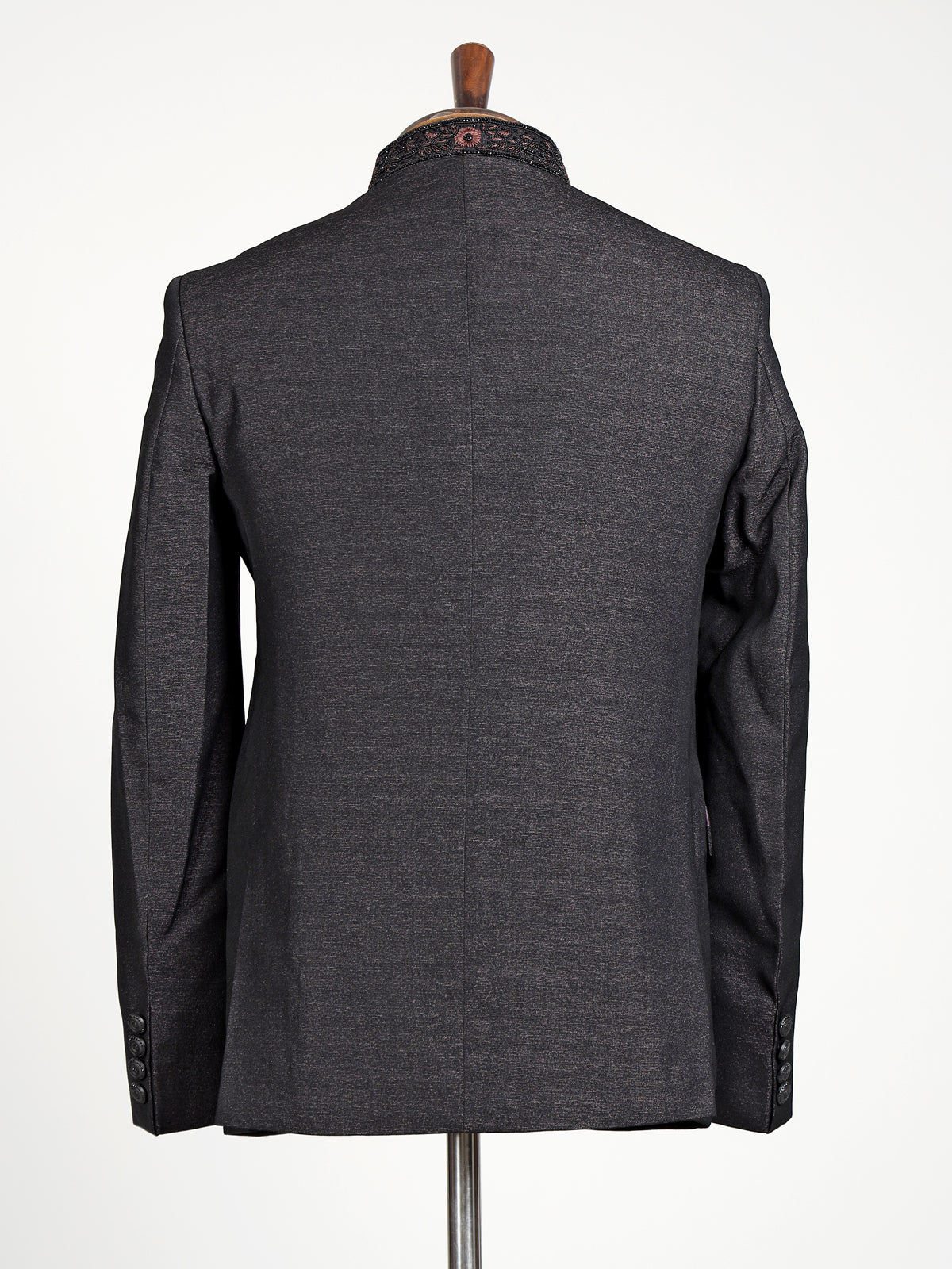 Jet black textured jodhpuri suit for mens with crest motif