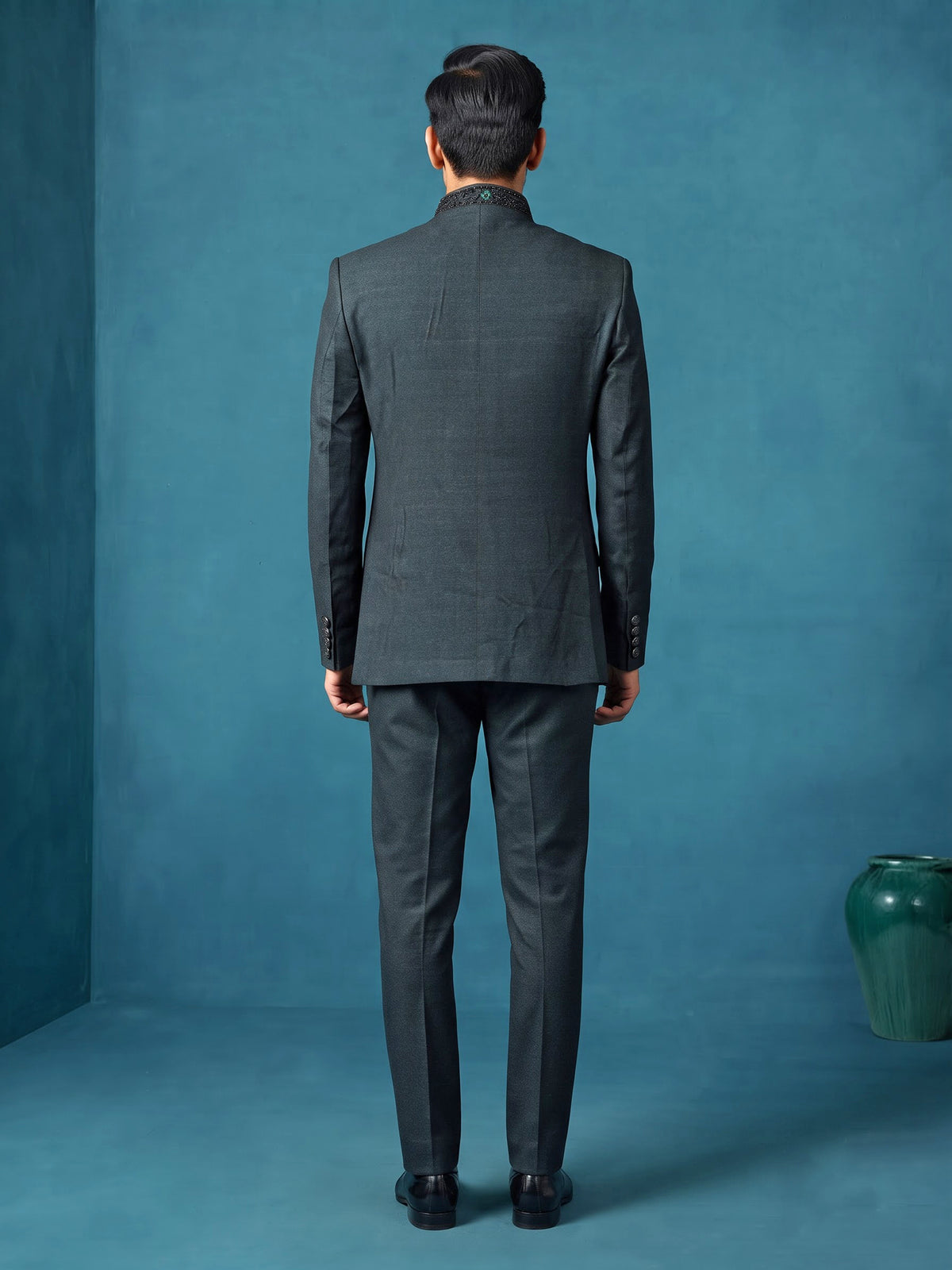 Deep emerald green textured jodhpuri suit for mens with crest