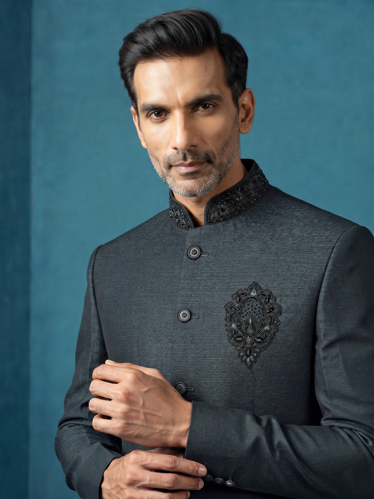 Deep emerald green textured jodhpuri suit for mens with crest