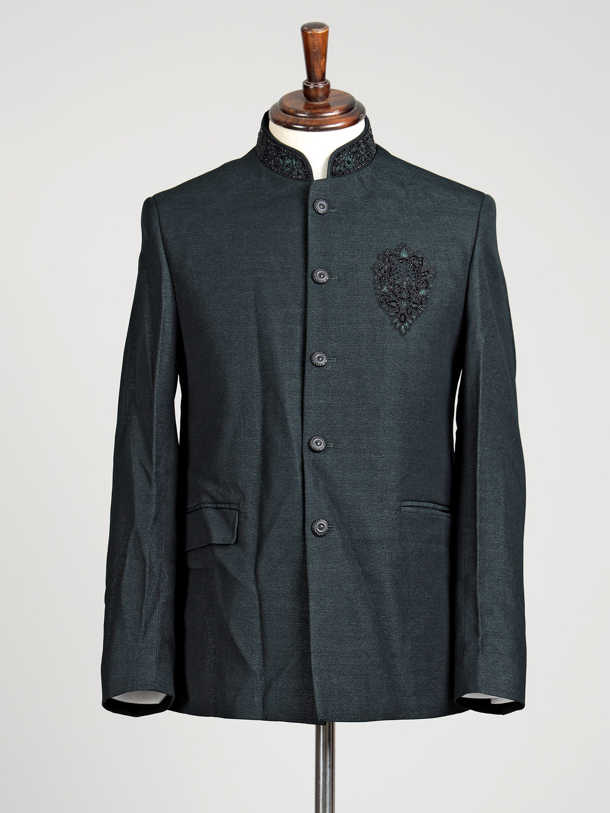 Deep emerald green textured jodhpuri suit for mens with crest