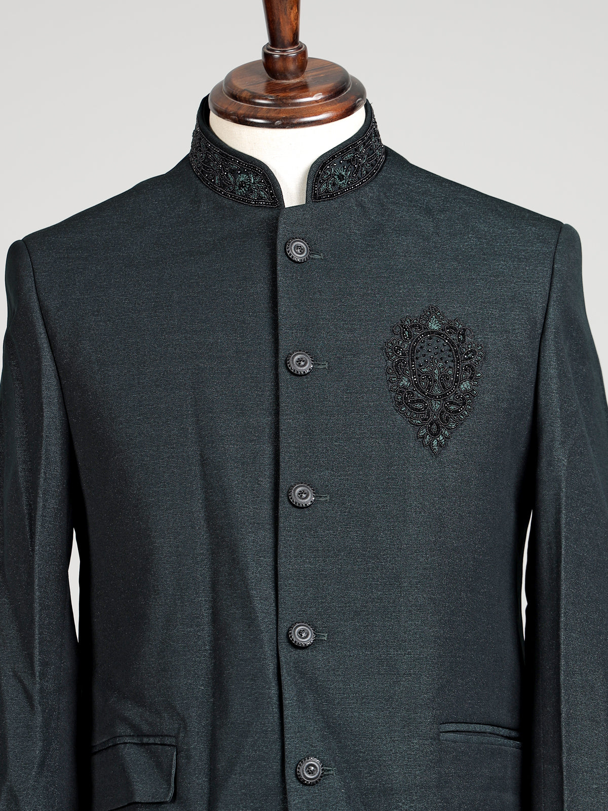 Deep emerald green textured jodhpuri suit for mens with crest