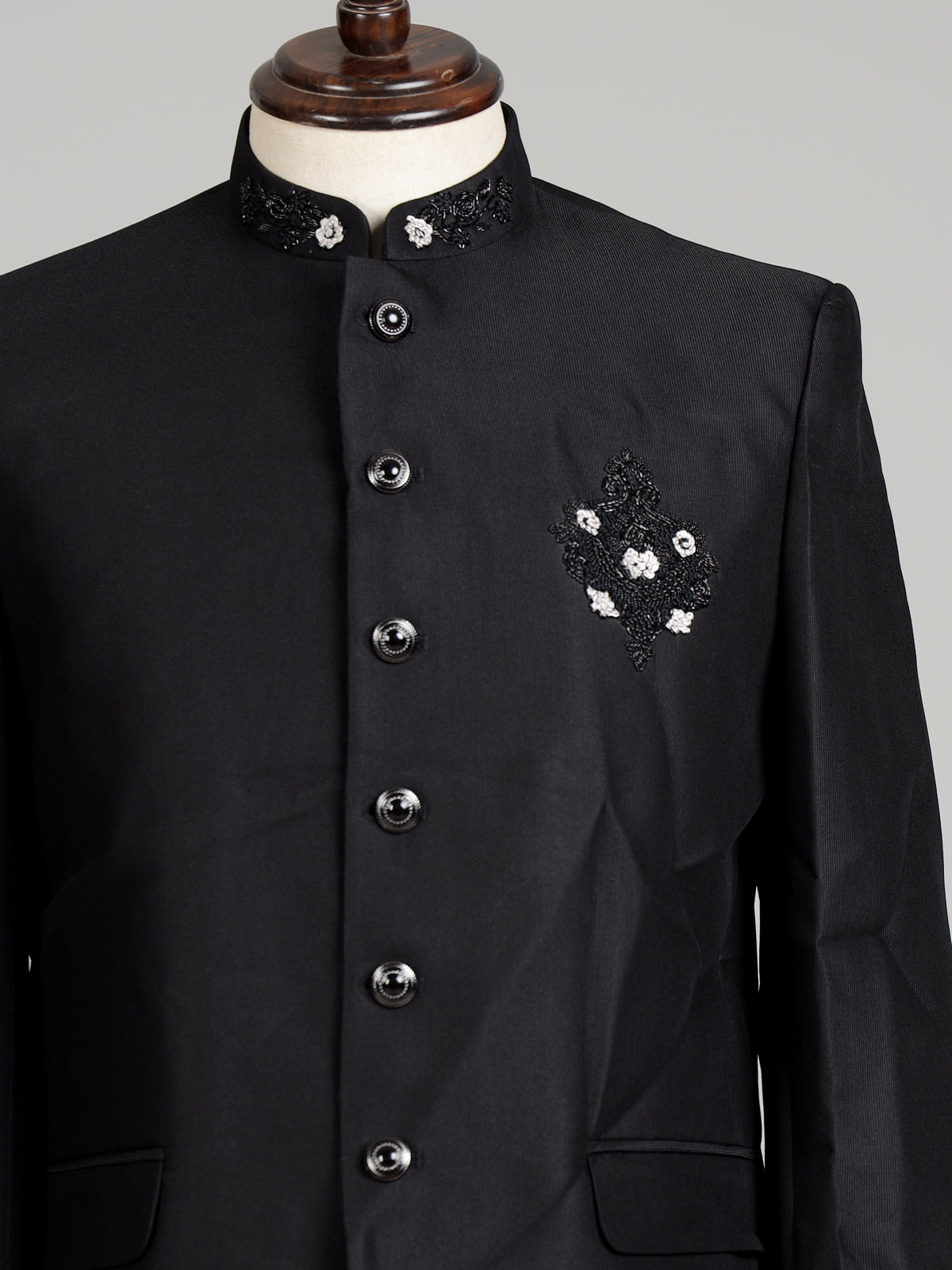 Black mens floral crest embroidered poly-viscose jodhpuri suit