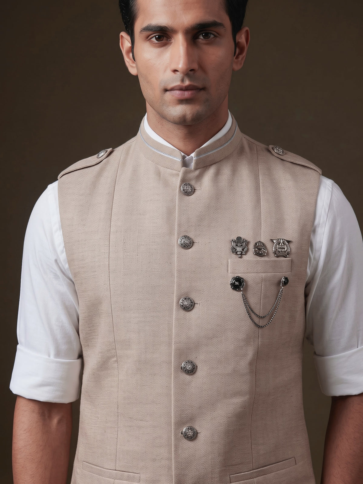 Beige textured waistcoat with metallic chain brooch detailing for mens