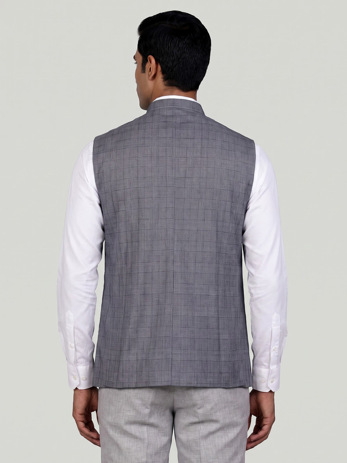 Grey micro-textured waistcoat with metallic brooch for mens weddings