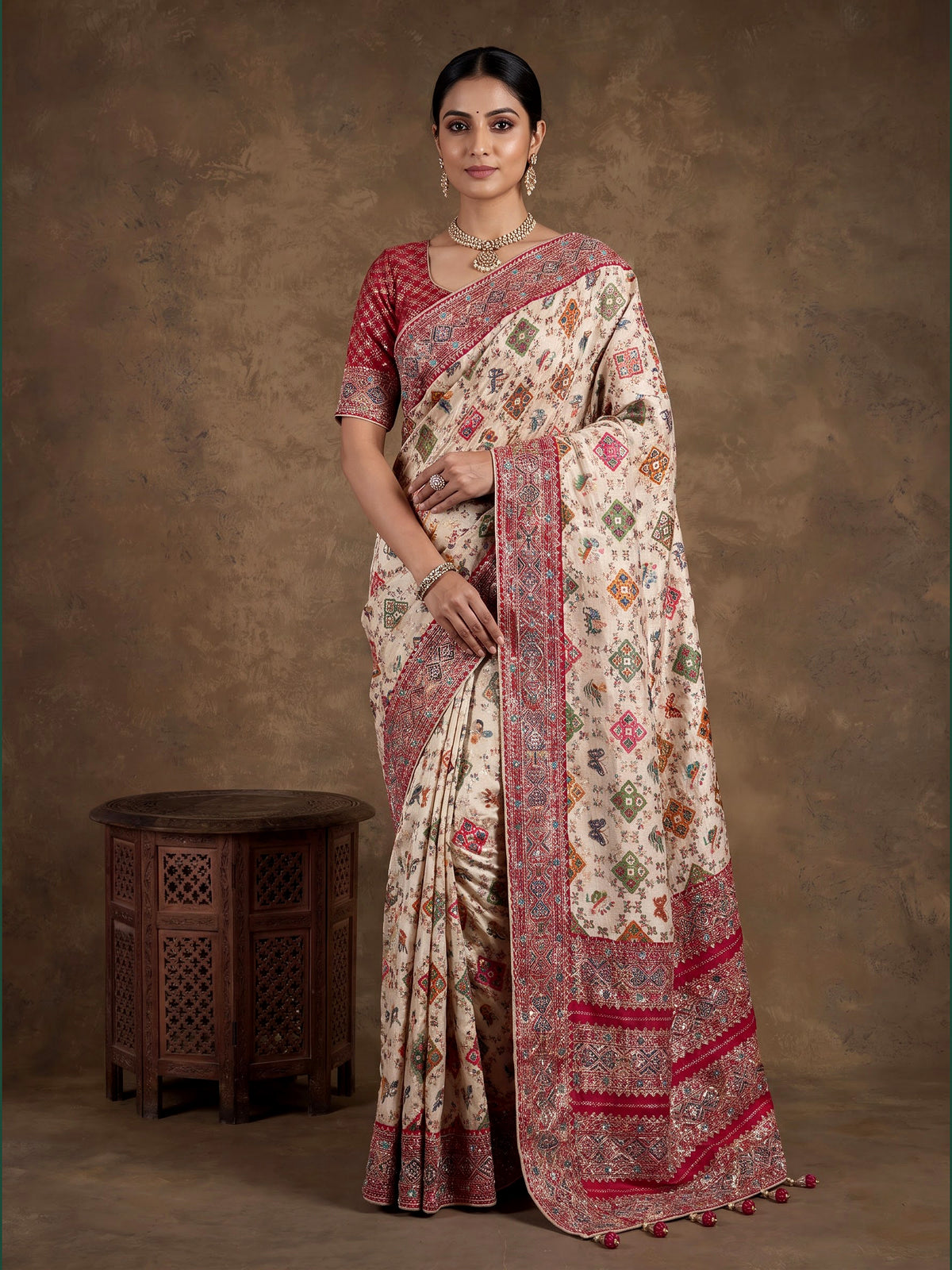 Beige modal silk Patola motif magenta zari border saree