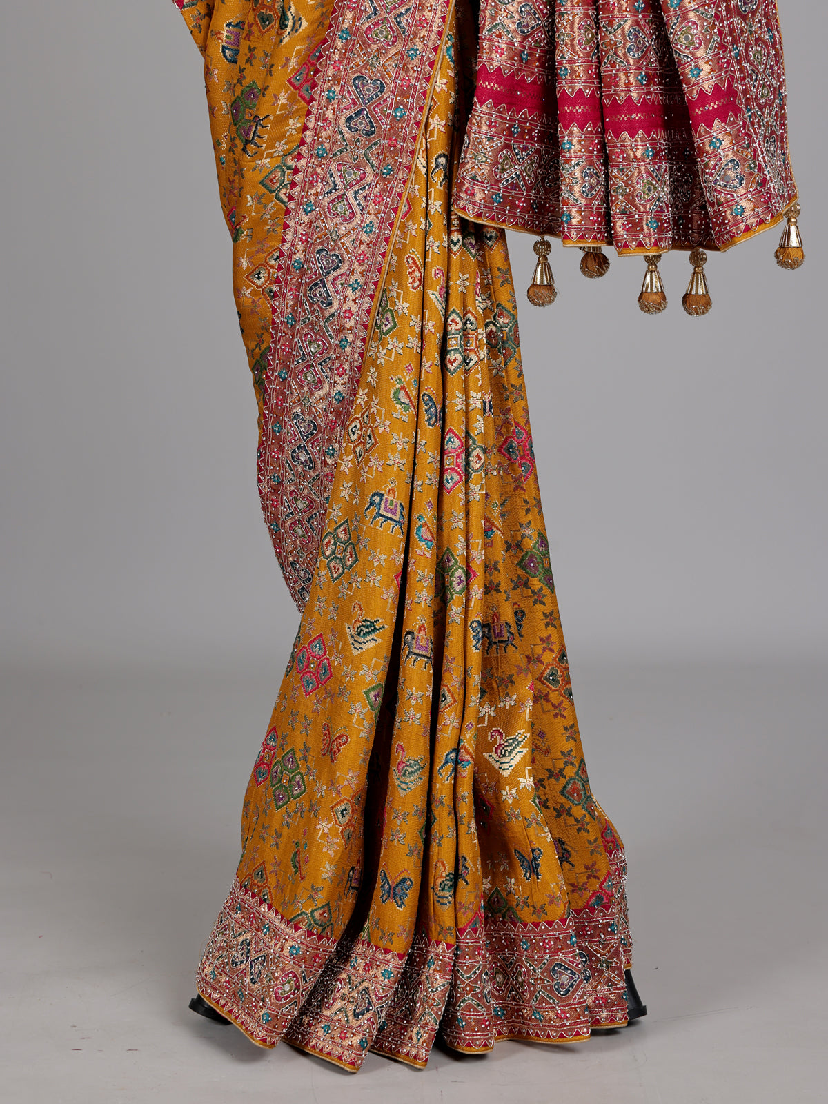 Mustard yellow modal silk Patola motif zari work saree