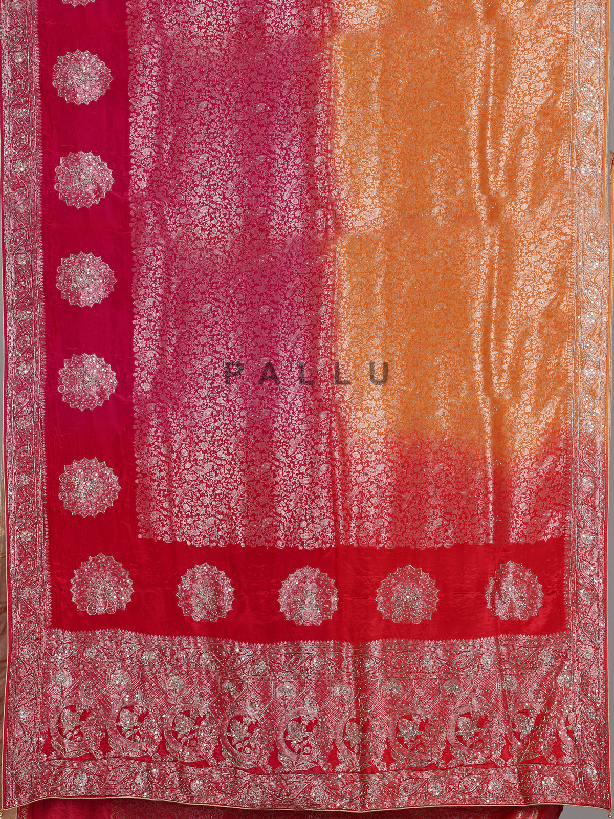 Red and yellow shaded embellished dola silk saree