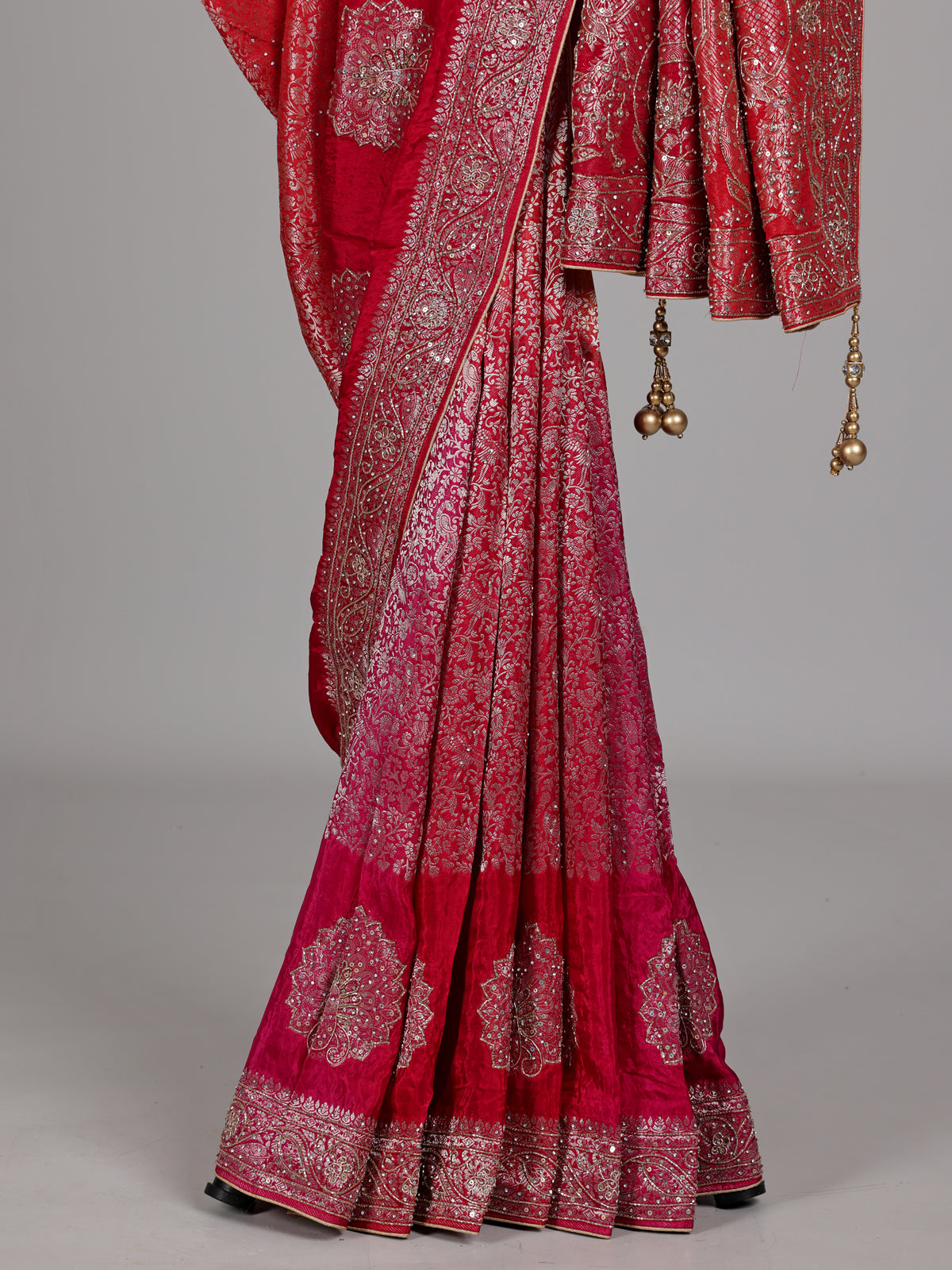 Red and yellow shaded embellished dola silk saree