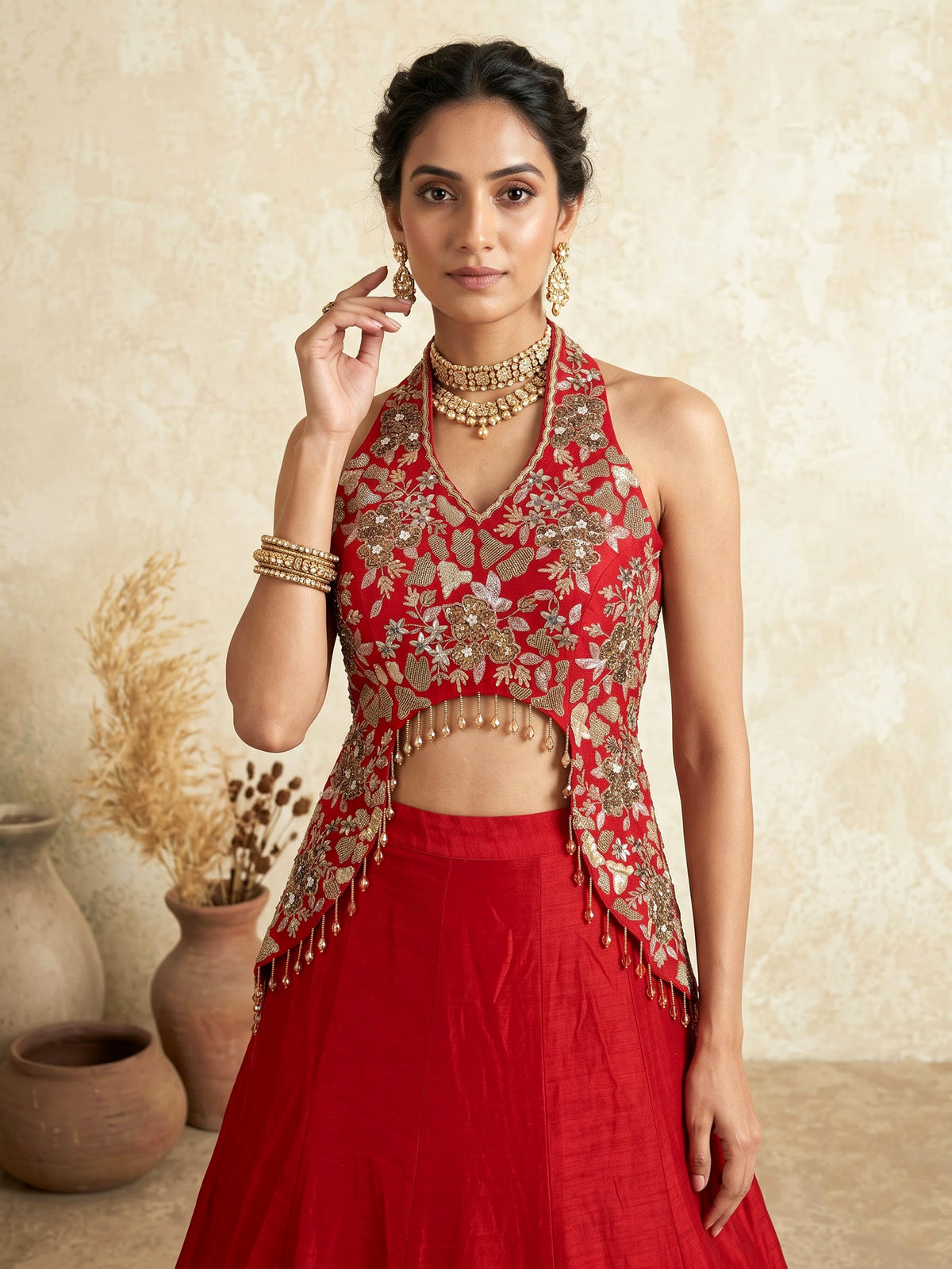 Red designer silk lehenga choli with tassel embellishments