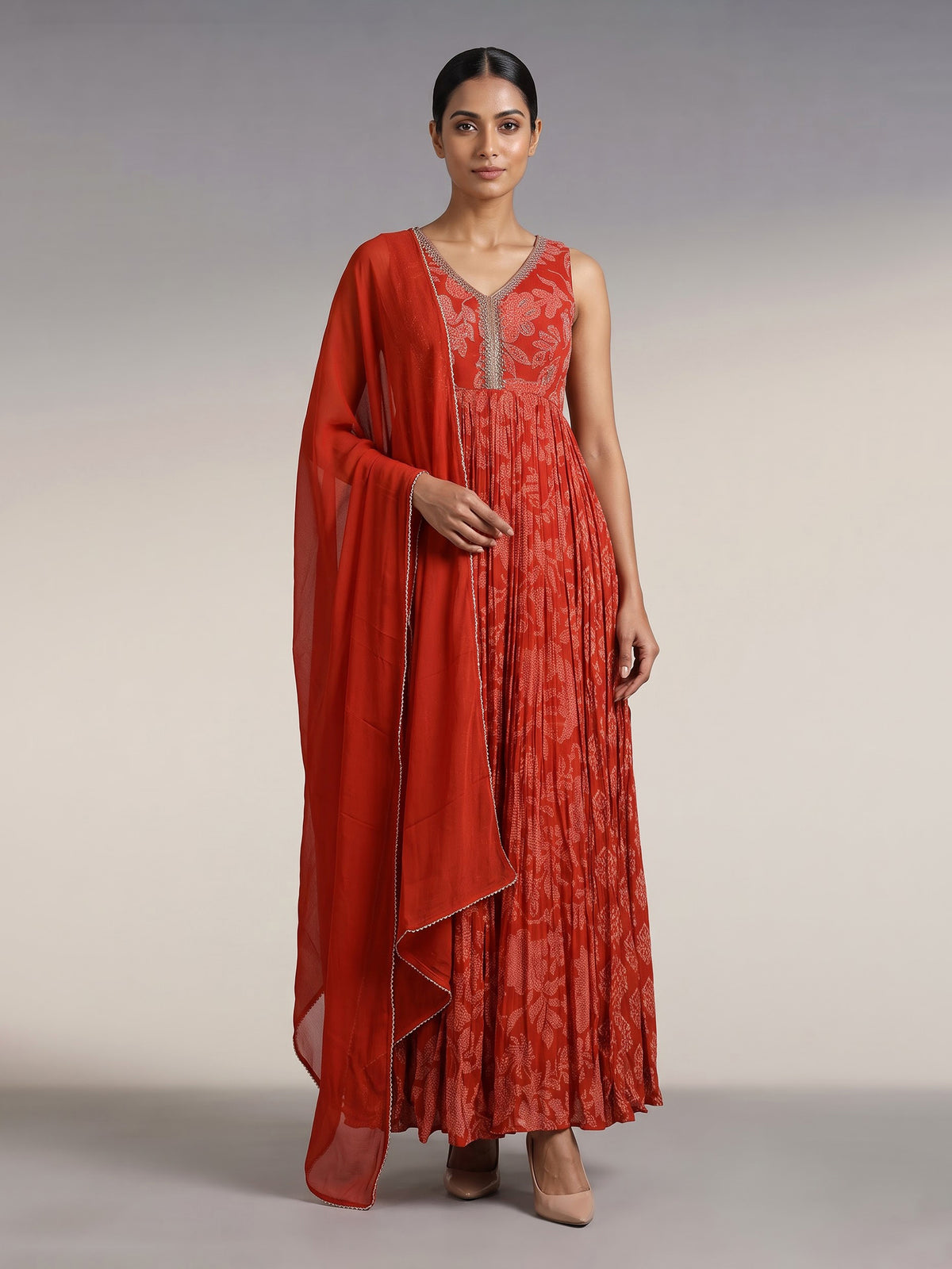 Rust red printed georgette silk anarkali with aabla embellishments