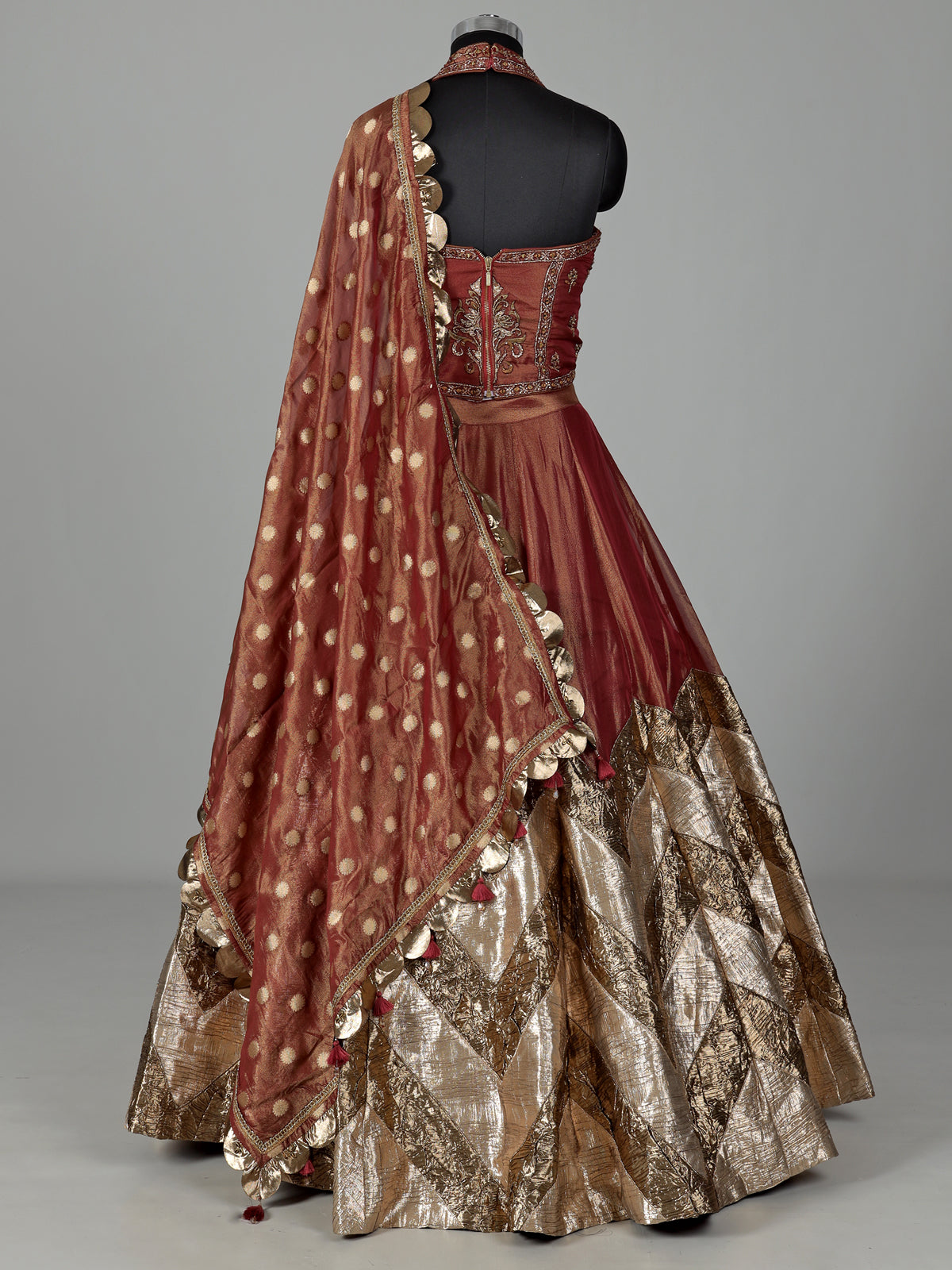 Rust red silk lehenga choli with intricate aabla embroidery
