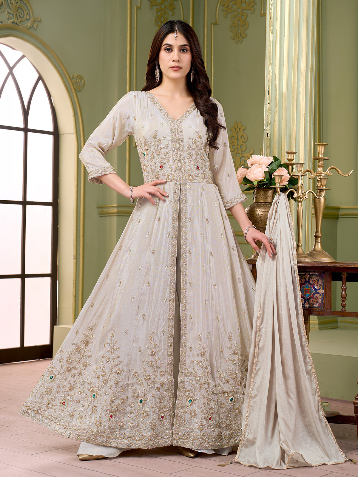 Cream silk anarkali salwar suit with embroidered butti work