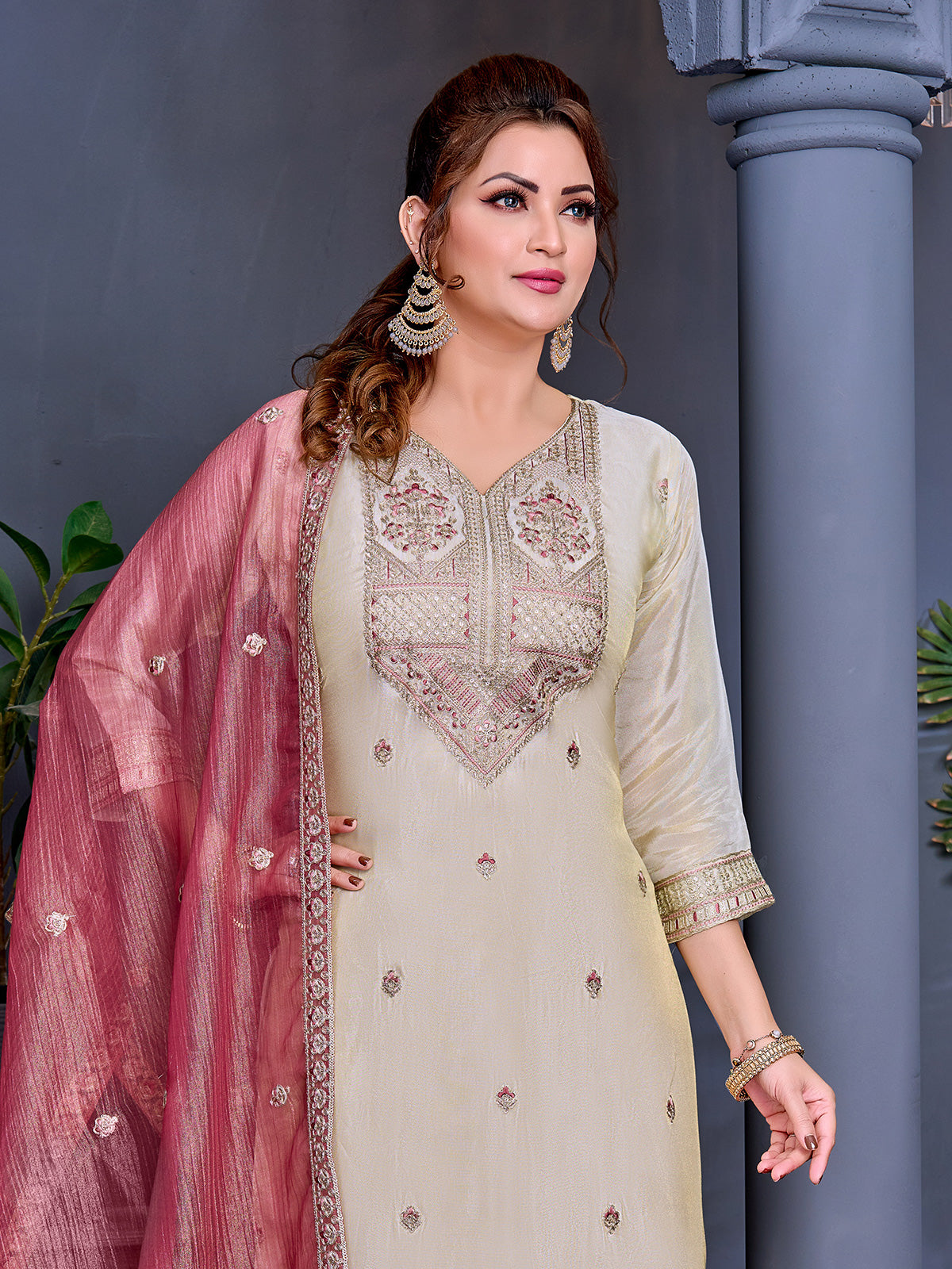 Cream shimmer salwar suit with peach contrast dupatta and yoke work