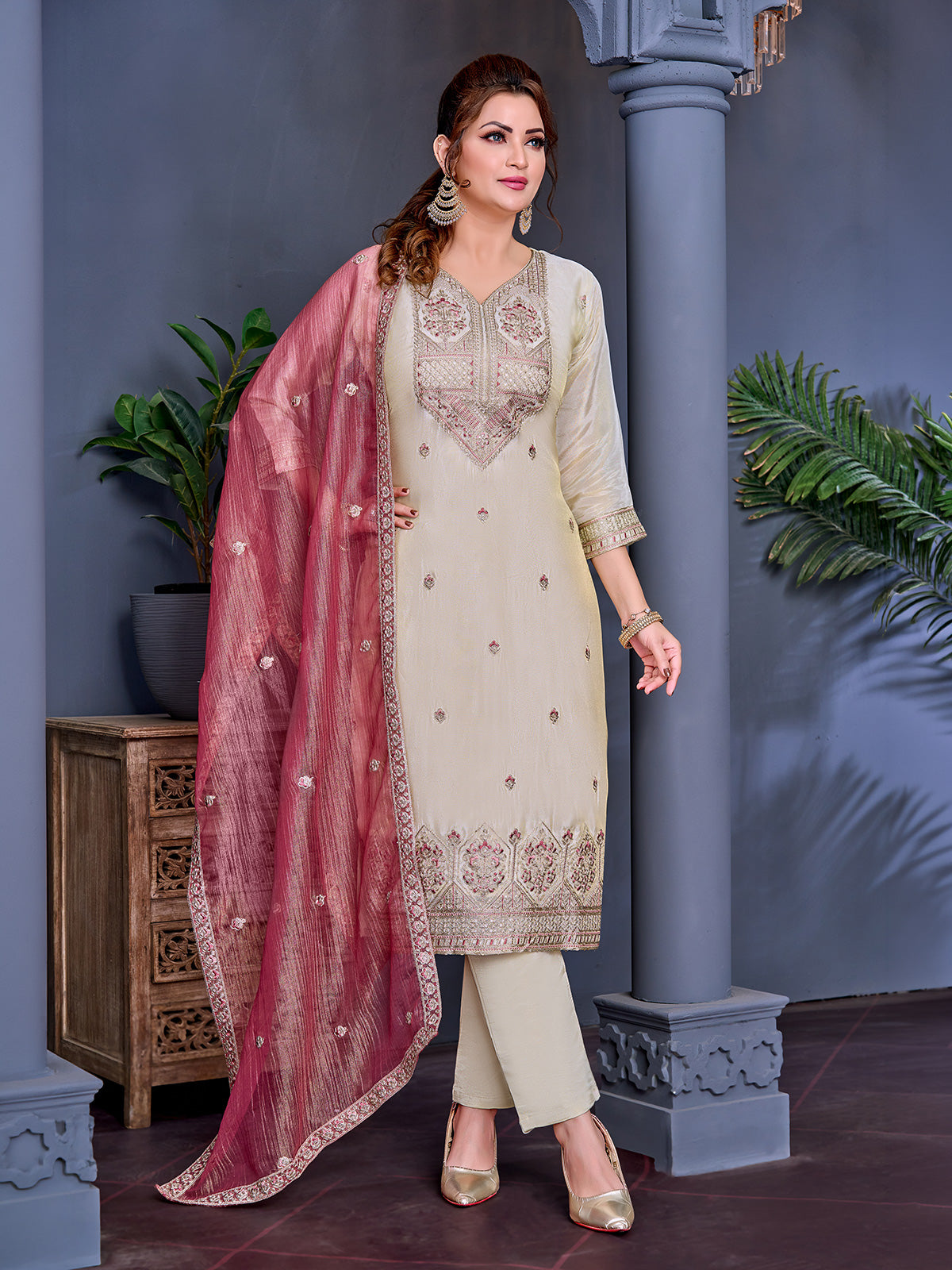 Cream shimmer salwar suit with peach contrast dupatta and yoke work