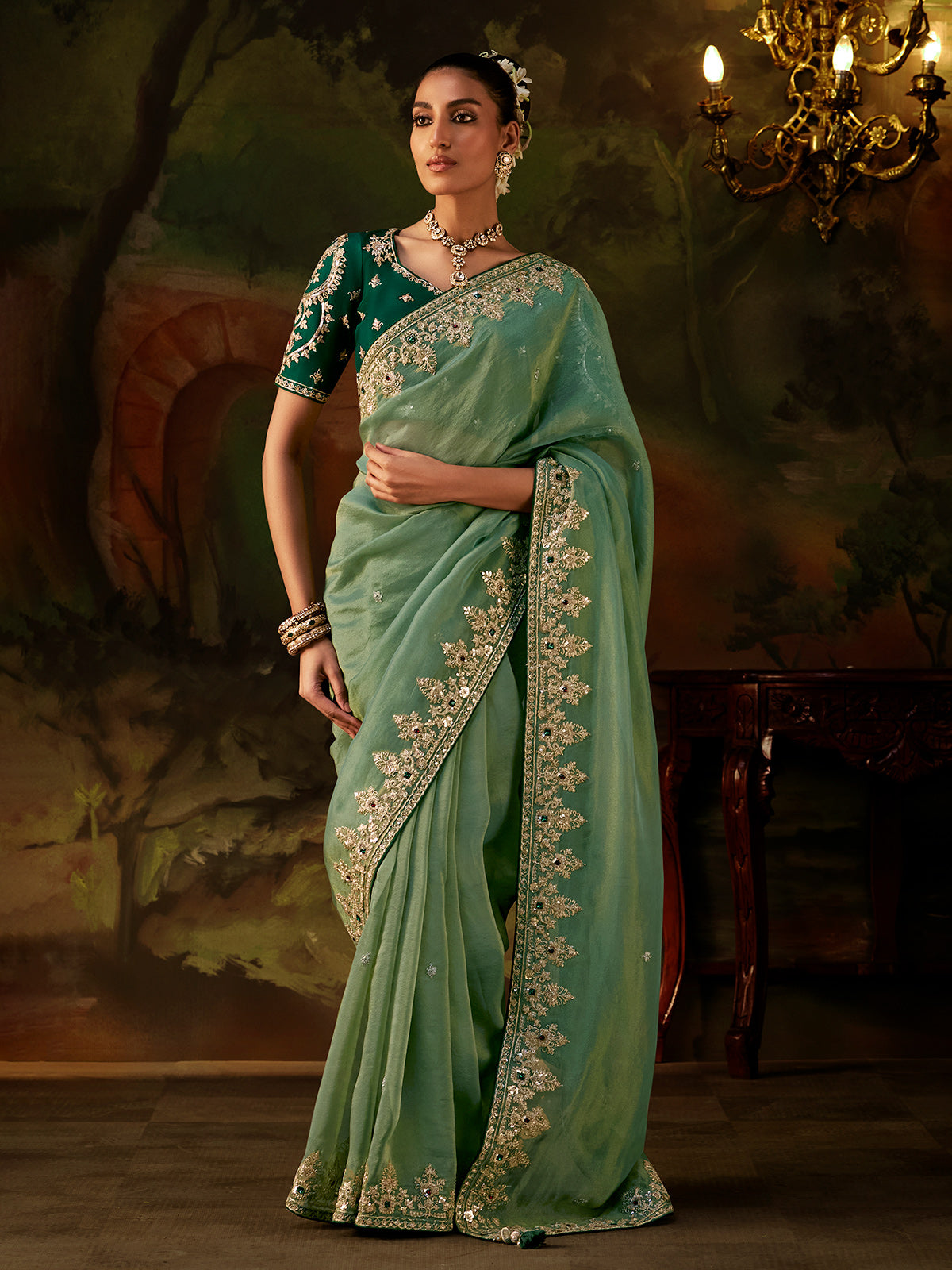 Green stone embellished tissue silk women saree