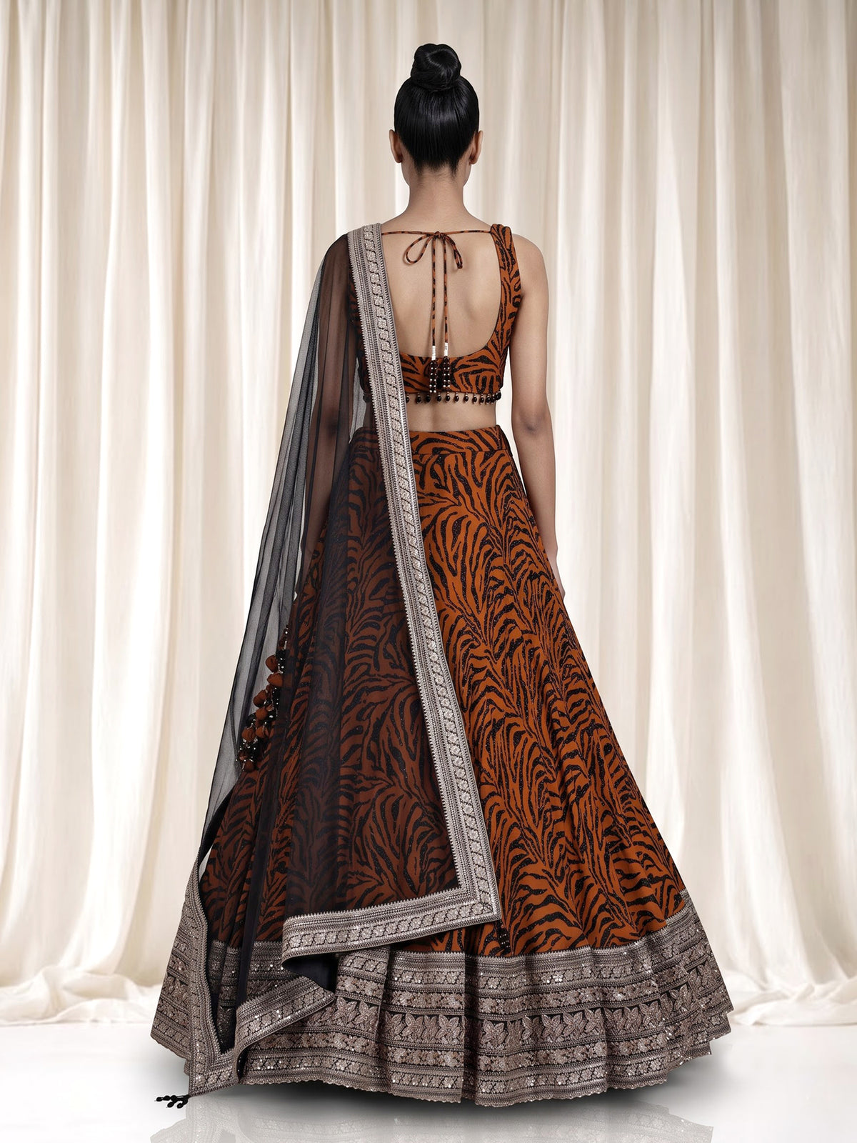 Orange silk lehenga choli with embroidered printed dupatta