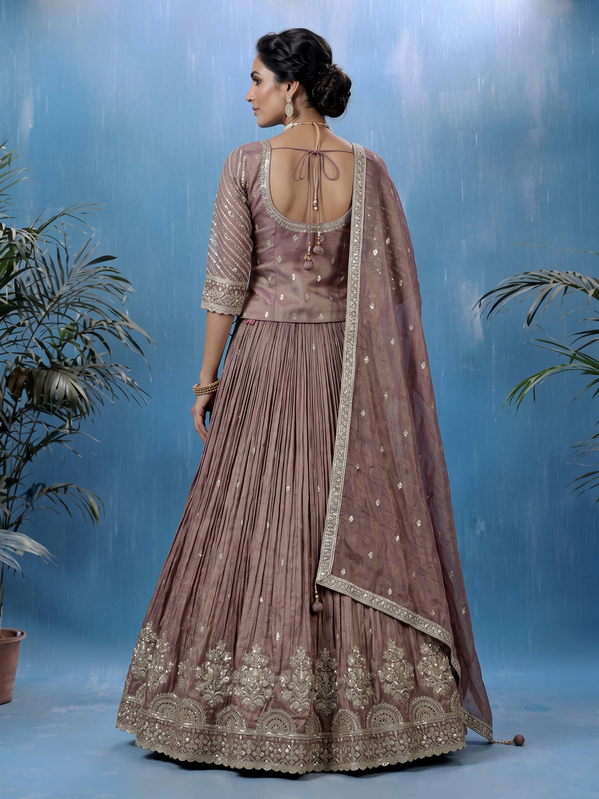 Pastel purple silk lehenga choli with intricate zardosi work