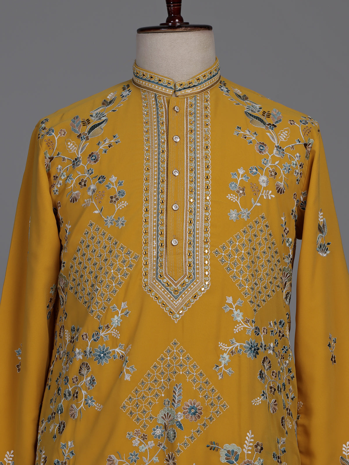 Mustard yellow georgette kurta suit with swan motif embellishments