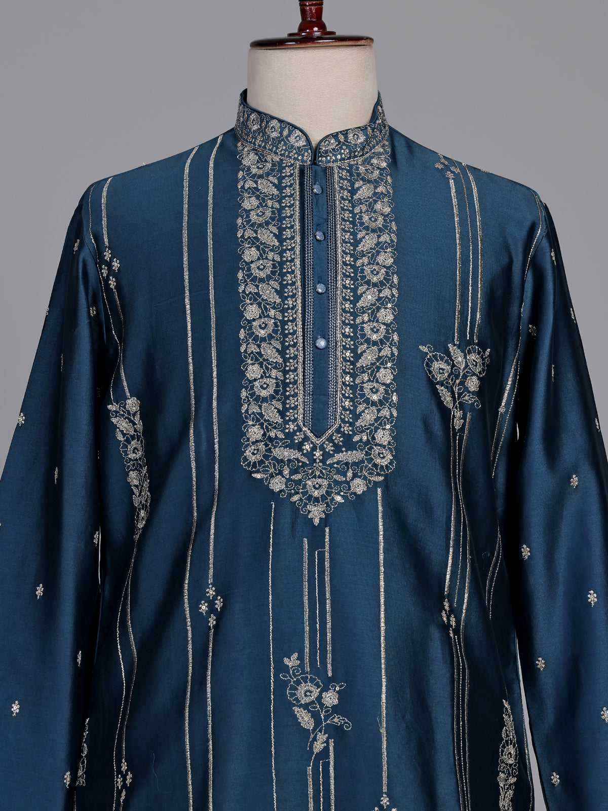 Deep teal silk kurta suit with golden embroidered neckline