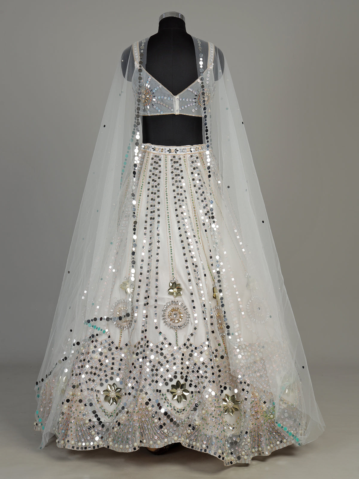 White net designer lehenga choli with sparkling diamond embellishments
