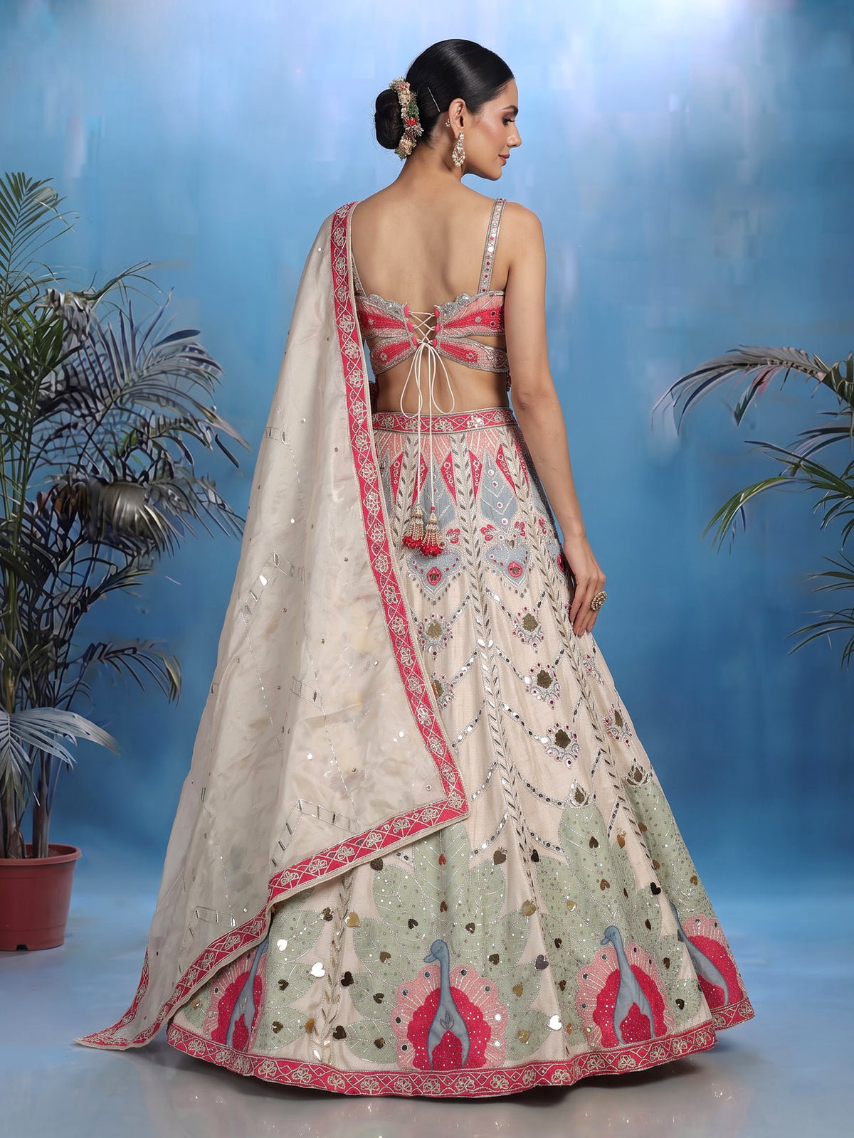 Beige raw silk peacock motif lehenga choli with mirror embellishments