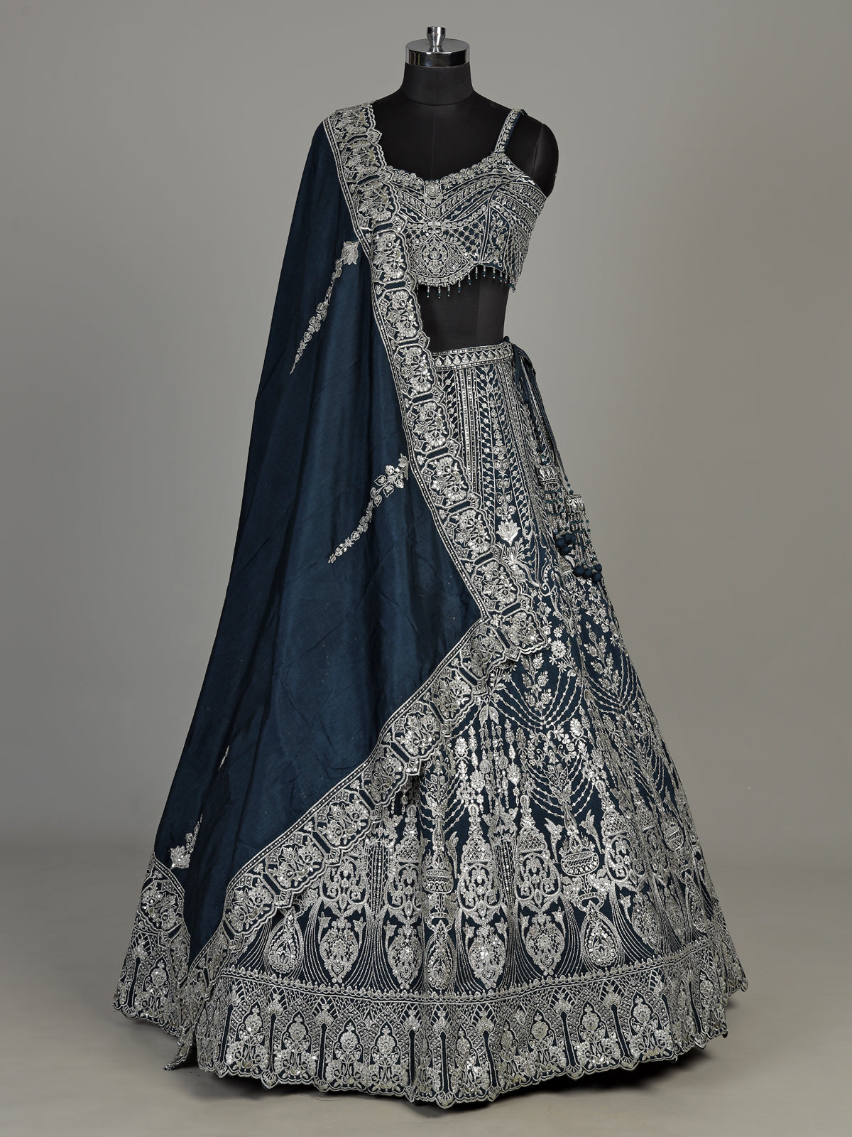 Peacock blue silk lehenga choli with heavy tassel embellishments