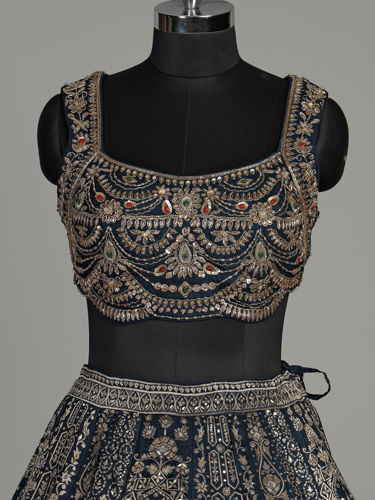 Teal blue silk lehenga choli with square neck zari embellishments