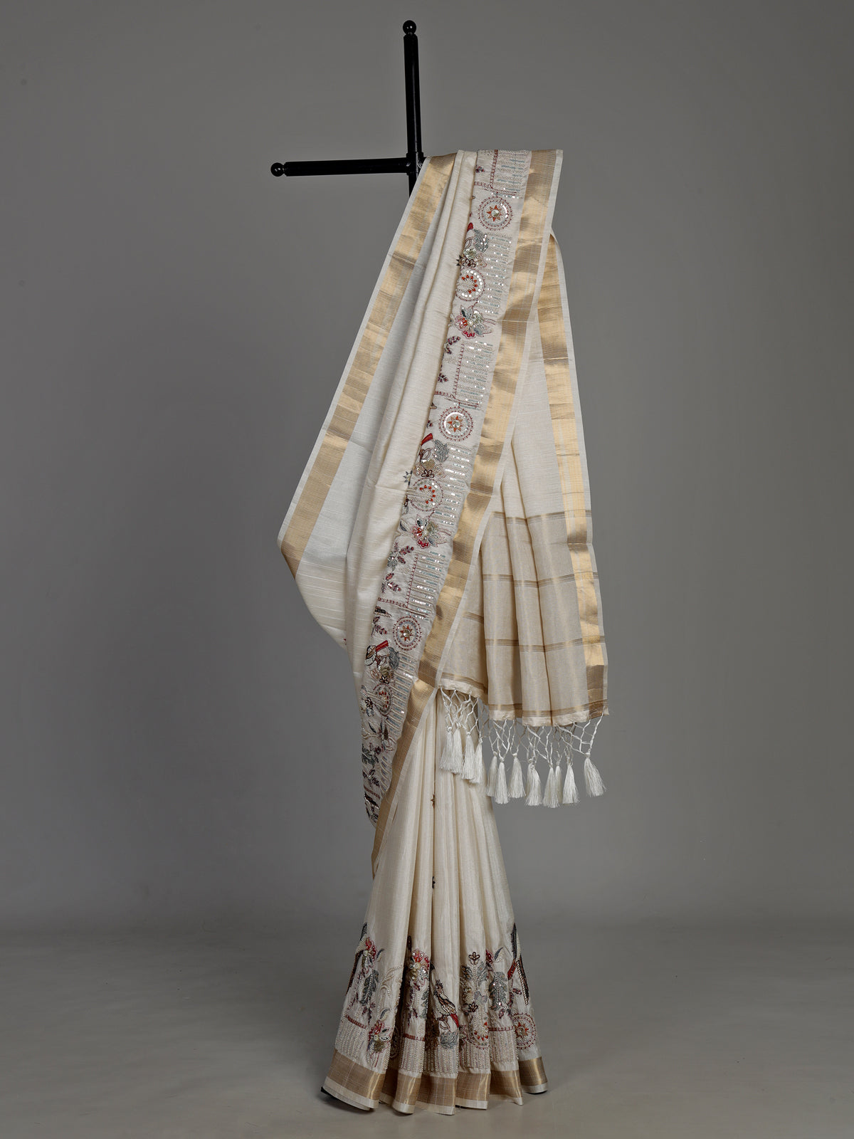 White semi cotton silk saree with embellished bird motifs and tasselled pallu