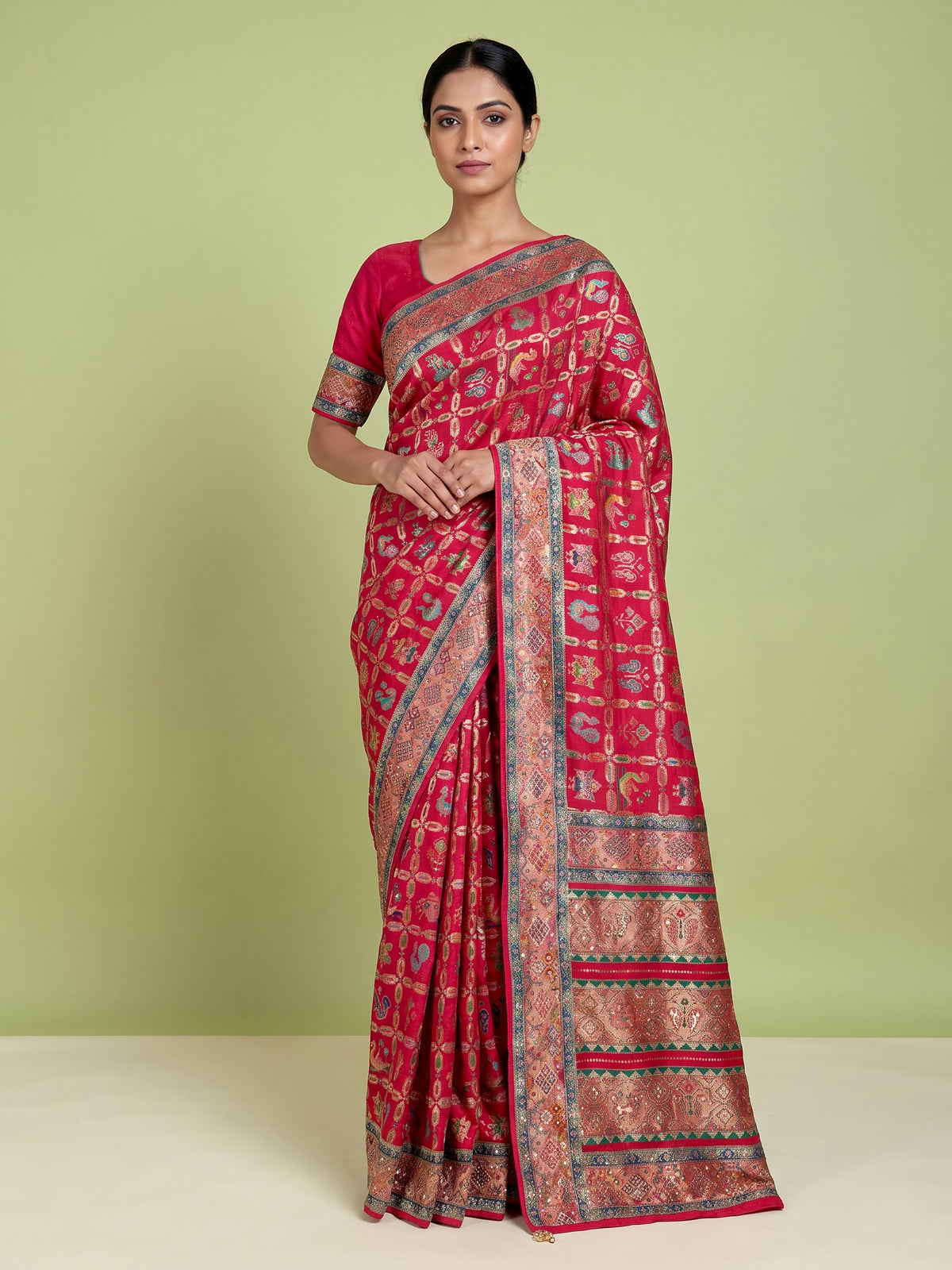 Deep rani pink modal satin saree with colourful motifs and embellishments