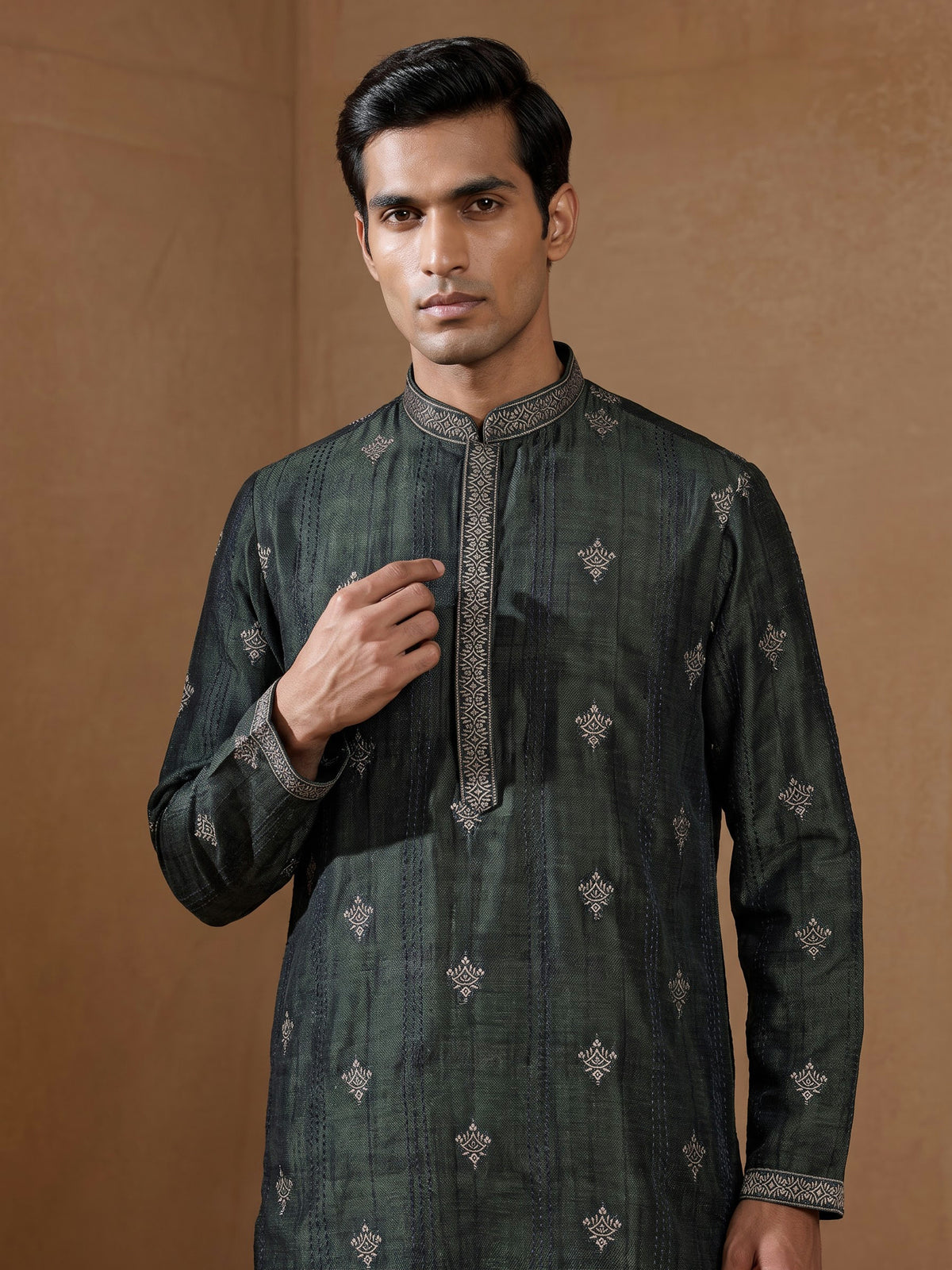 Forest green silk blend kurta set with antique silver detailing